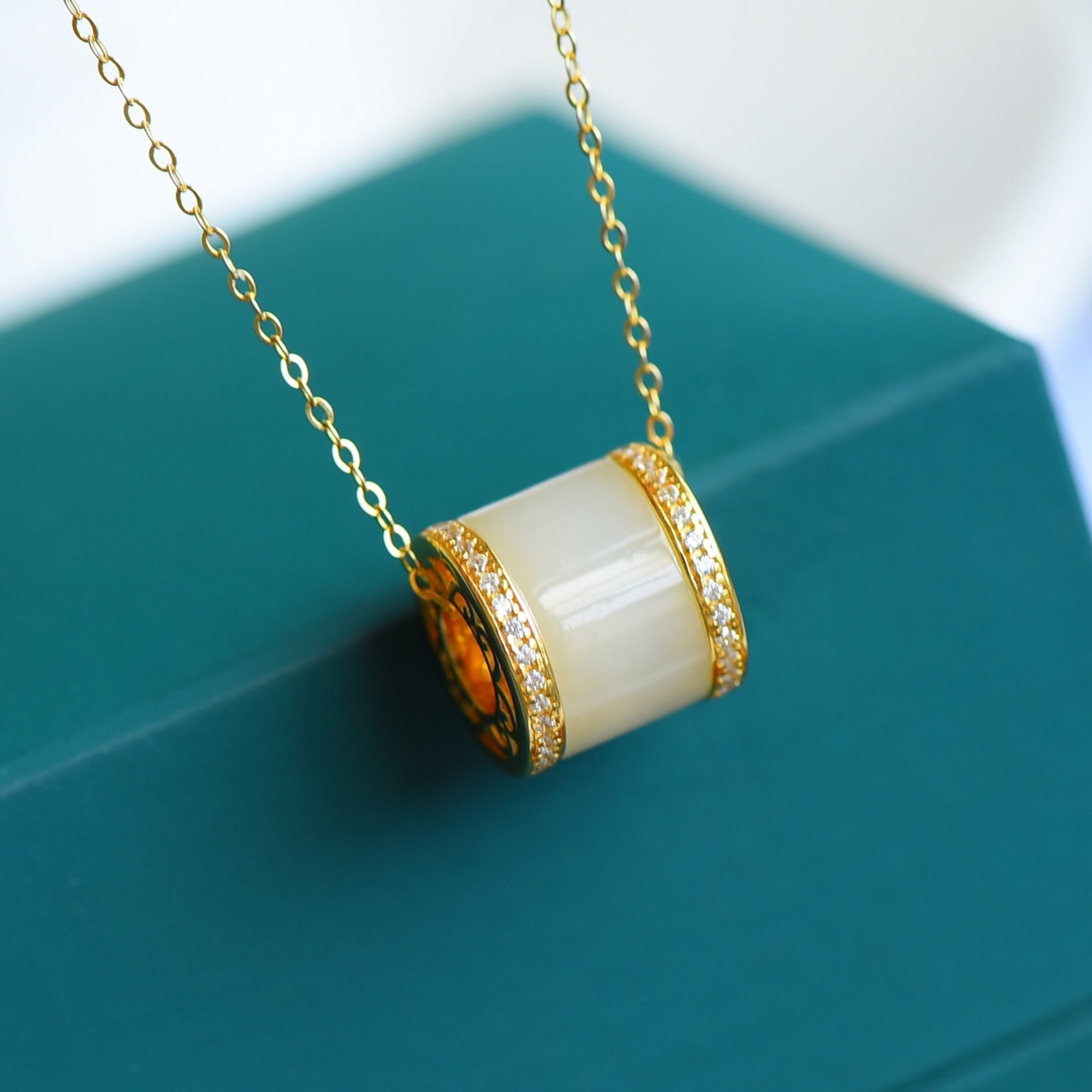 An Exquisite Sterling Silver-Gold Plated Inlaid White Jade Pendant: An Exquisite Sterling Silver-Gold Plated Inlaid White Jade Pendant,Size:7mmx12mm 纯银镀金镶白玉吊坠