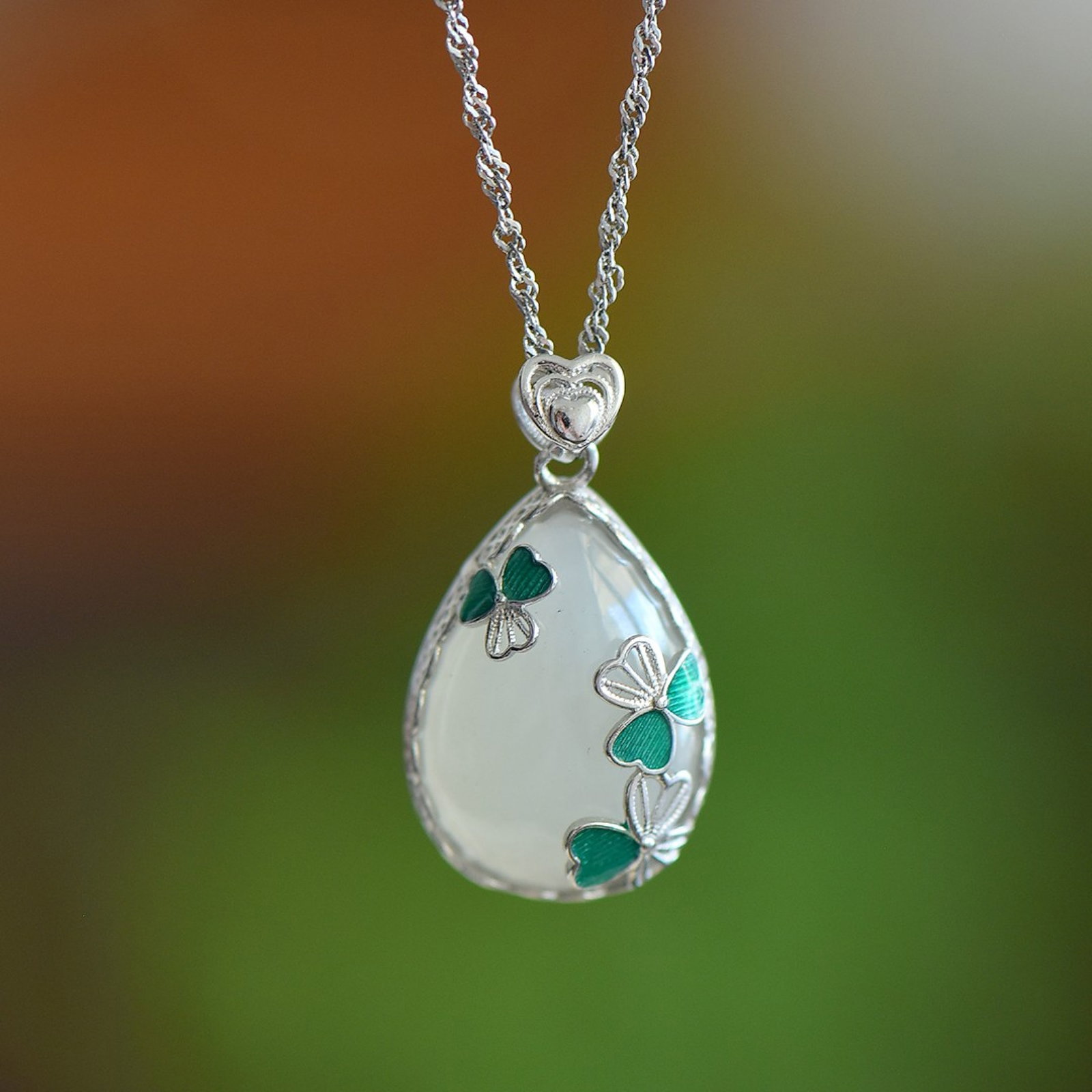 An Exquisite Sterling Silver Inlaid White Jade Pendant: An Exquisite Sterling Silver Inlaid White Jade Pendant,Size:13mmx18mm 纯银镶白玉吊坠