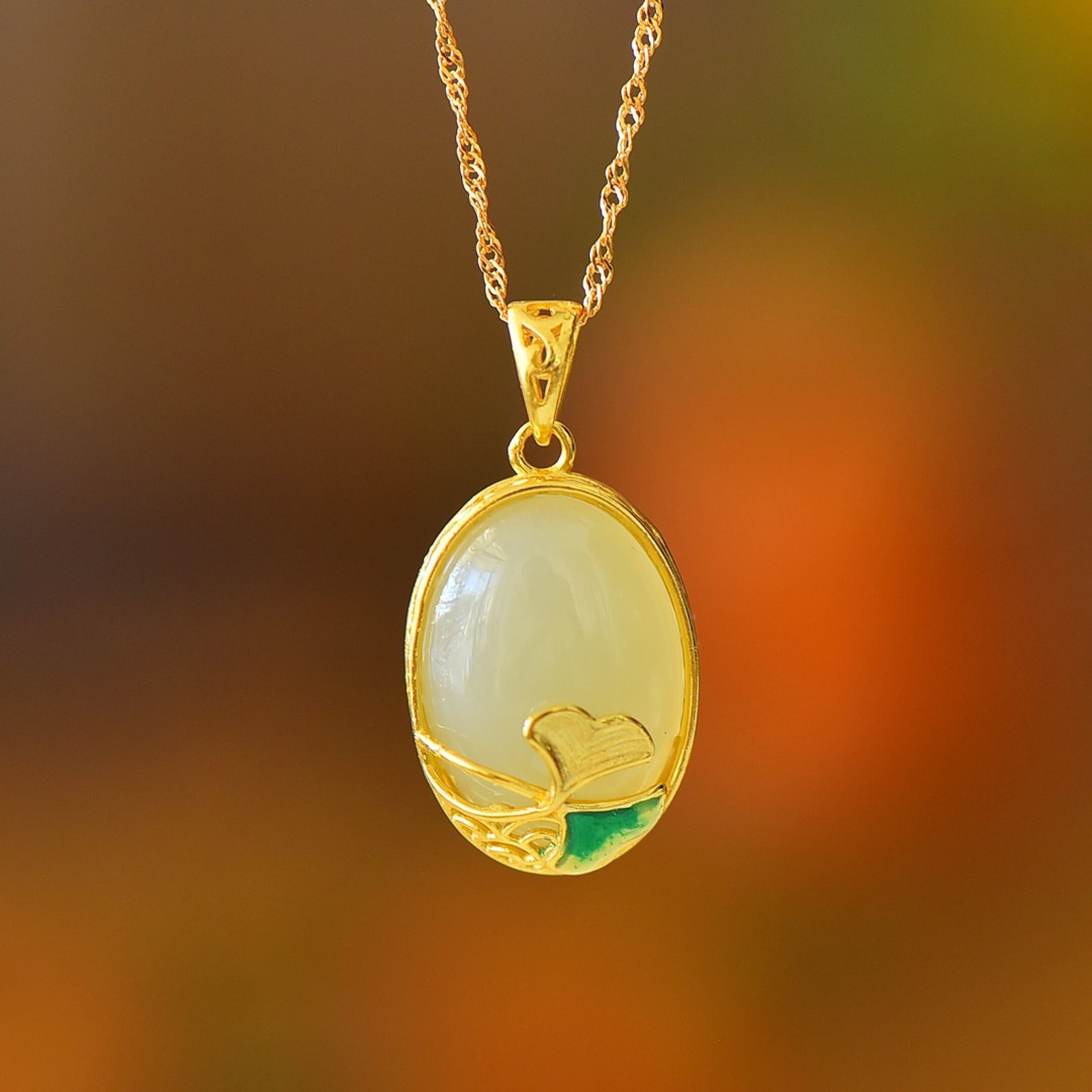 An Exquisite Sterling Silver-Gold Plated Inlaid White Jade Pendant: An Exquisite Sterling Silver-Gold Plated Inlaid White Jade Pendant 纯银镀金镶白玉吊坠