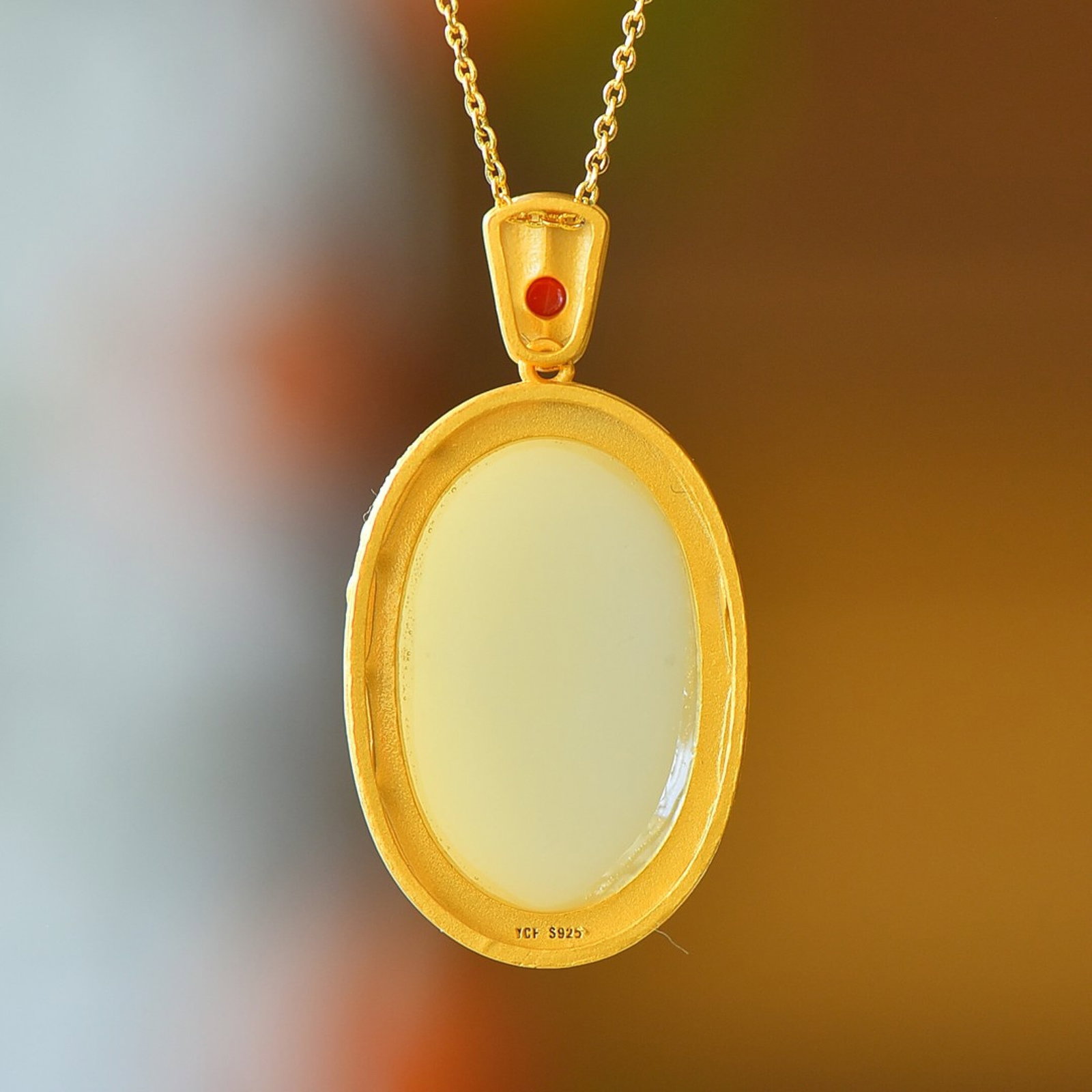 An Exquisite Sterling Silver-Gold Plated Inlaid White Jade Pendant: An Exquisite Sterling Silver-Gold Plated Inlaid White Jade Pendant,Size:20mmx30mm 纯银镀金镶白玉吊坠