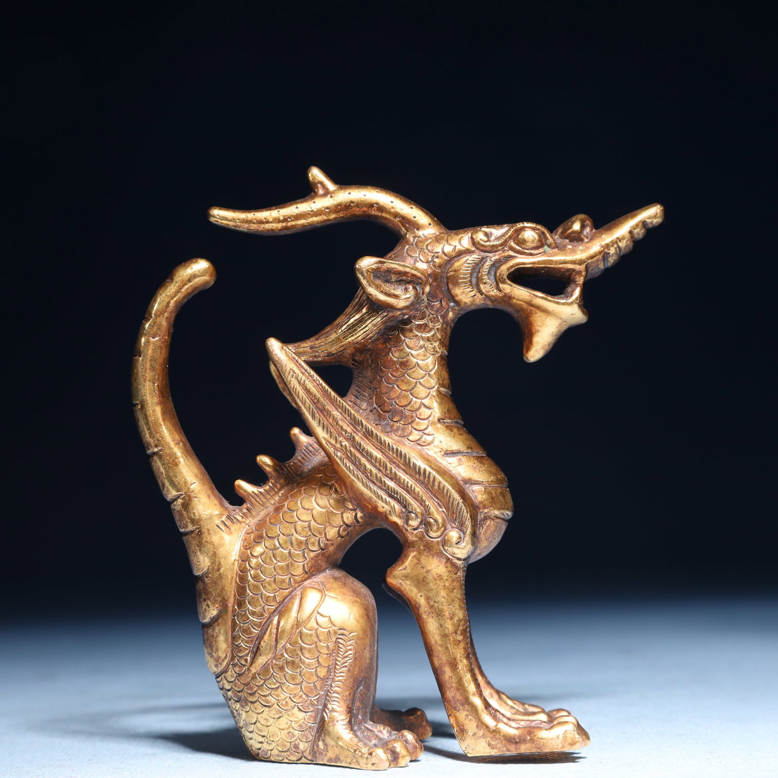 An Exquisite Gilt Bronze Dragon Ornament: An Exquisite Gilt Bronze Dragon Ornament,Qing Dynasty,China,Size:3.5inx1.6inx3.9in,Weight:400g 铜鎏金龙摆件,中国清代