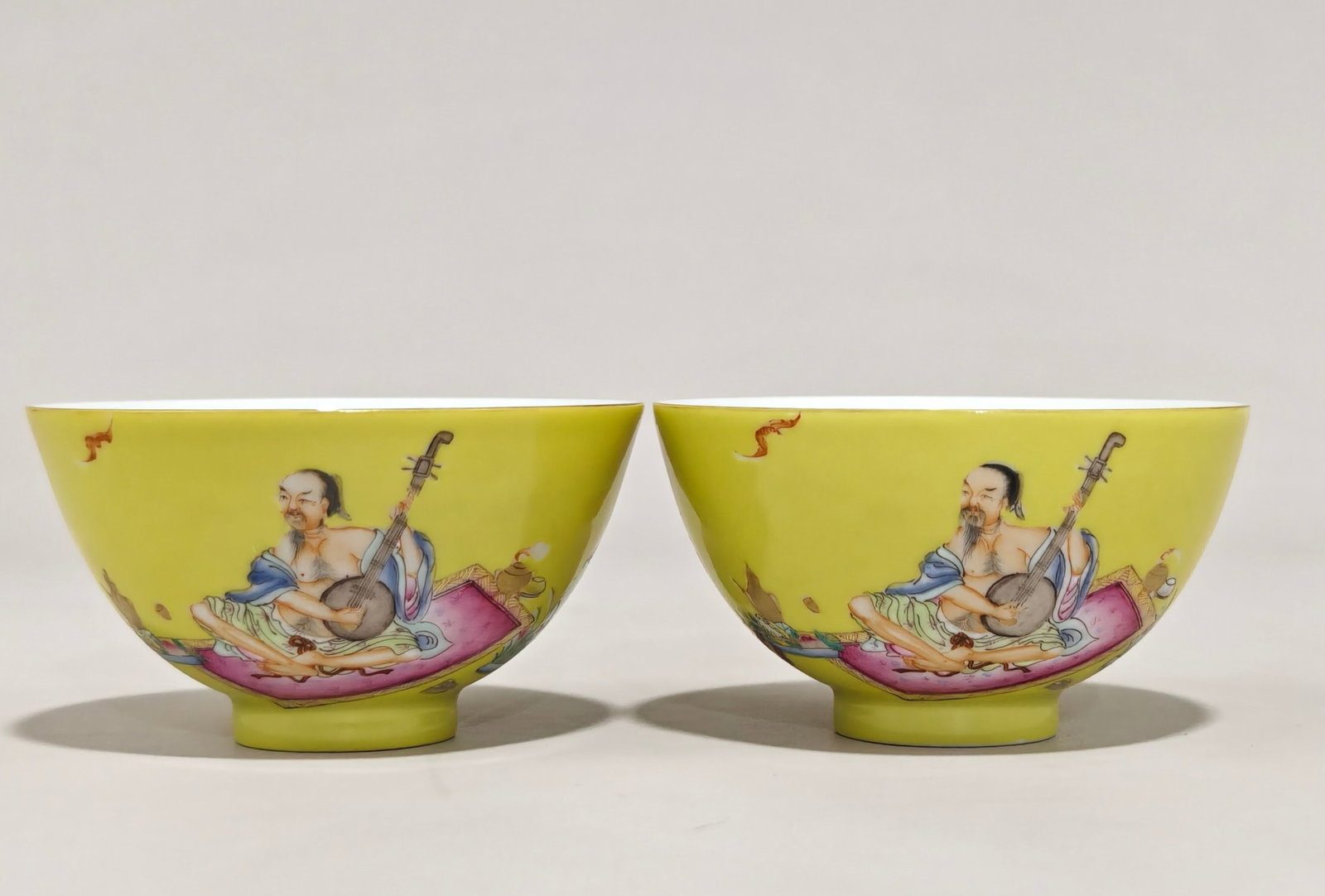 A Pair of Exquisite Famille-Rose Yellow Glazed Painted Gold Lotus and Figure Pattern Cups,With Poem: A Pair of Exquisite Famille-Rose Yellow Glazed Painted Gold Lotus and Figure Pattern Cups,With Poem,Qing Dynasty,China,Yongzheng Four-character Mark,Size:1.8inx3.3in 一对粉彩&#