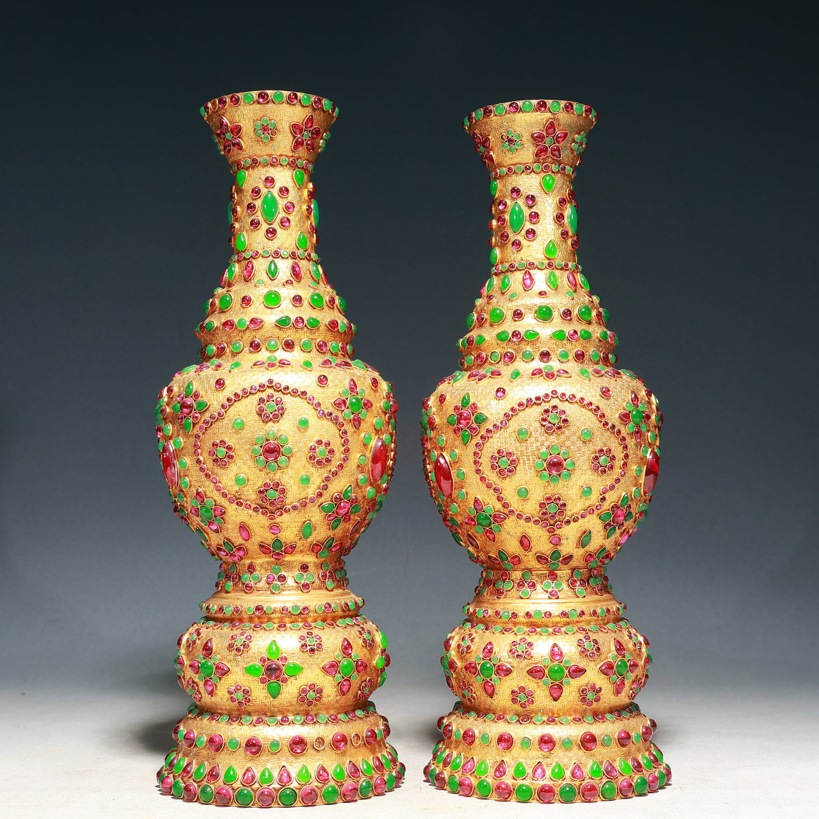 A Pair of Rare Gilt Bronze Inlaid Gems Vases: A Pair of Rare Gilt Bronze Inlaid Gems Vases,Qing Dynasty, China,Qianlong Four-character Mark,Size:4.3inx13.8in,Weight:3200g 一对铜鎏金嵌宝石瓶,&#