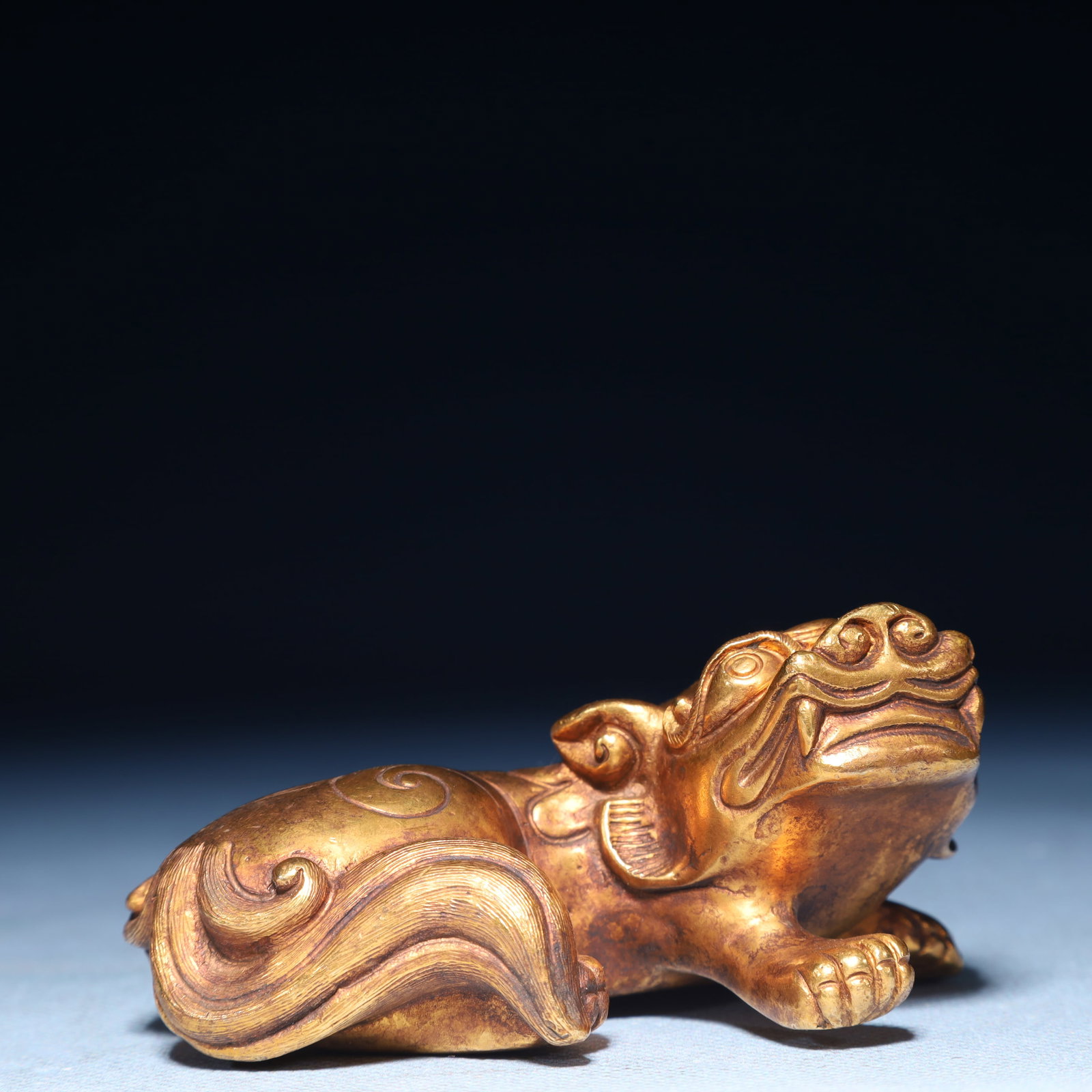 An Exquisite Gilt Bronze Unicorn Ornament: An Exquisite Gilt Bronze Unicorn Ornament,Qing Dynasty,China,Size:3.5inx2.4inx1.6in,Weight:650g 铜鎏金独角兽摆件,中国清代
