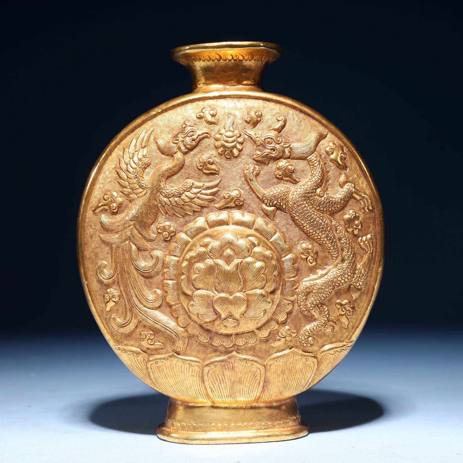 An Exquisite Gilt Bronze Dragon and Phoenix Pattern Vase: An Exquisite Gilt Bronze Dragon and Phoenix Pattern Vase,Qing Dynasty,China,Size:7.1inx5.5inx1.8in,Weight:550g 铜鎏金龙凤纹瓶,中国清代