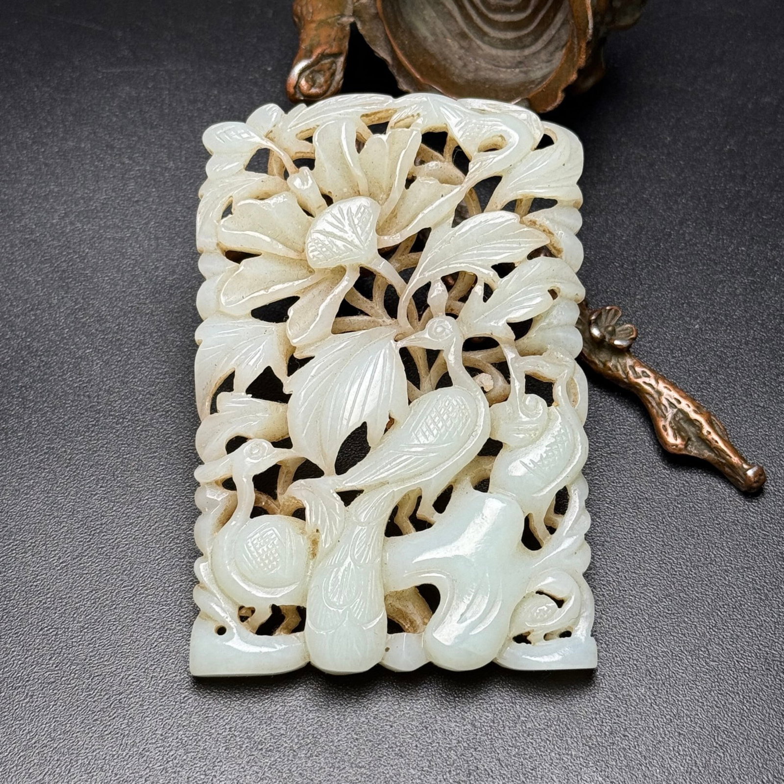 An Exquisite White Jade Flower and Bird Pattern Pendant: An Exquisite White Jade Flower and Bird Pattern Pendant,Qing Dynasty,China,Size:52mmx78mmx8mm,Weight:50g 白玉花鸟纹挂件,中国清代
