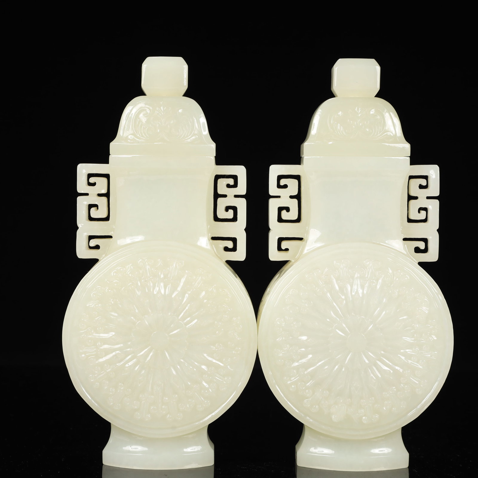 A Pair of Exquisite White Jade Flower Pattern Double-Ears Bottles: A Pair of Exquisite White Jade Flower Pattern Double-Ears Bottles,Qing Dynasty, China,Size:3.9inx1.8inx8.3in,Weight:1200g 一对白玉花卉纹双耳௢