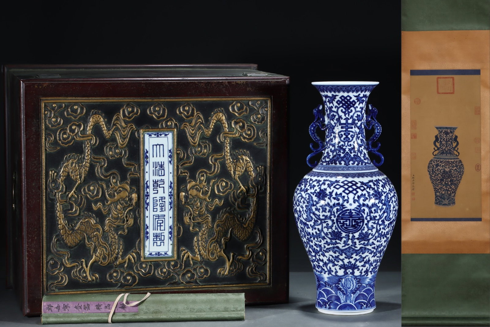 A Huge Blue and White Seawater Bats and Peach Pattern Dragon-Ears Vase,With Vertical Scroll Painting: A Huge Blue and White Seawater Bats and Peach Pattern Dragon-Ears Vase,With Vertical Scroll Painting on Silk,Qing Dynasty, China,Qianlong Six-character Mark,Size:18.3inx8.1in,(Without frame)24.6inx12.