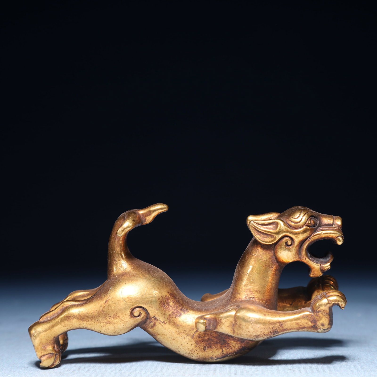 An Exquisite Gilt Bronze Beast Ornament: An Exquisite Gilt Bronze Beast Ornament,Qing Dynasty,China,Size:2inx1.6inx4.3in,Weight:500g 铜鎏金兽摆件,中国清代