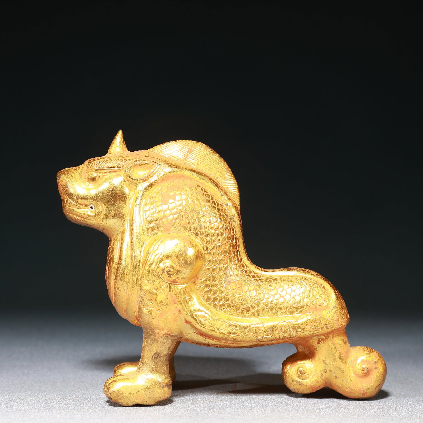 An Exquisite Gilt Bronze Unicorn Ornament: An Exquisite Gilt Bronze Unicorn Ornament,Qing Dynasty,China,Size:5.3inx2inx4.3in,Weight:200g 铜鎏金独角兽摆件,中国清代