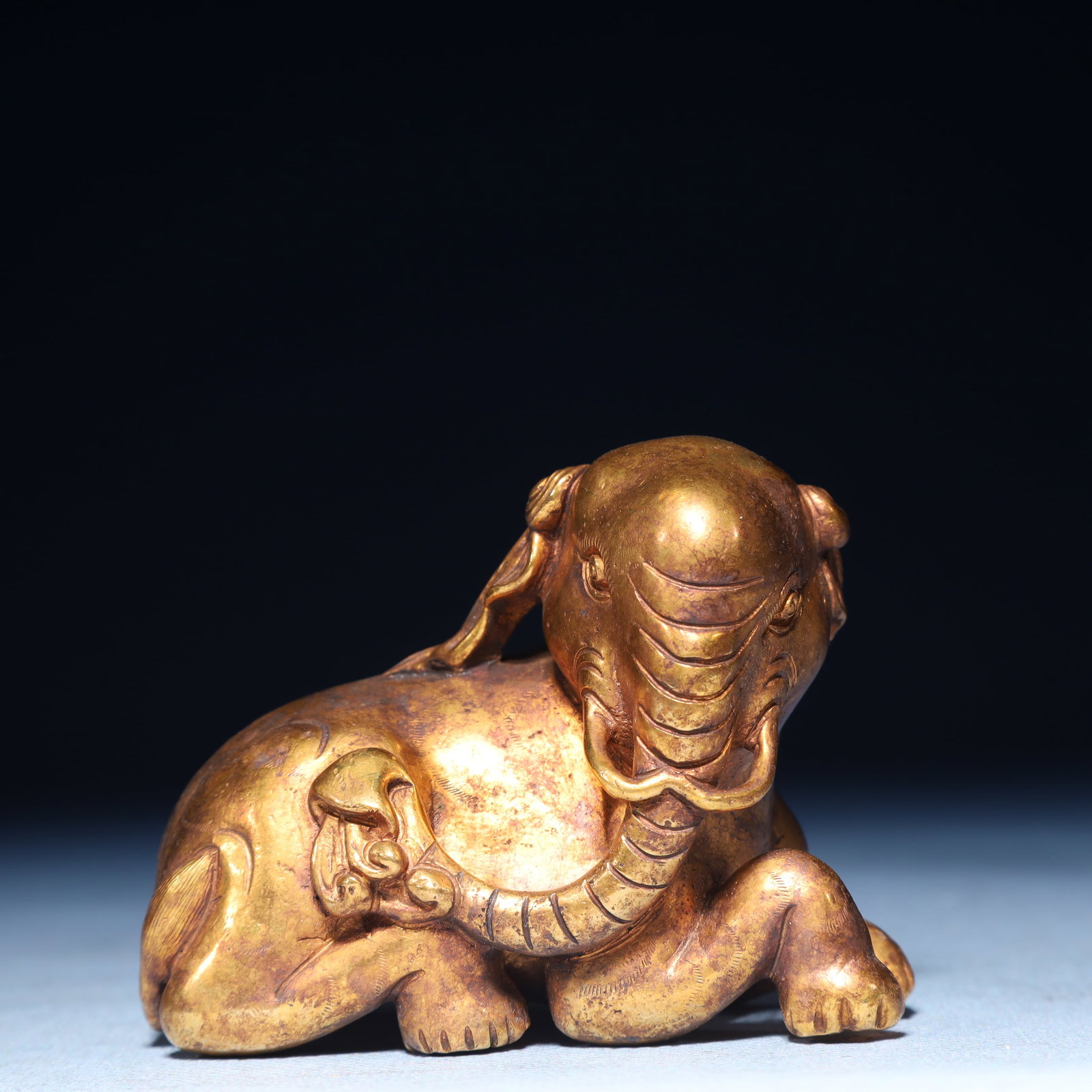An Exquisite Gilt Bronze Elephant Ornament: An Exquisite Gilt Bronze Elephant Ornament,Qing Dynasty,China,Size:3.1inx1.6inx2.4in,Weight:650g 铜鎏金象摆件,中国清代