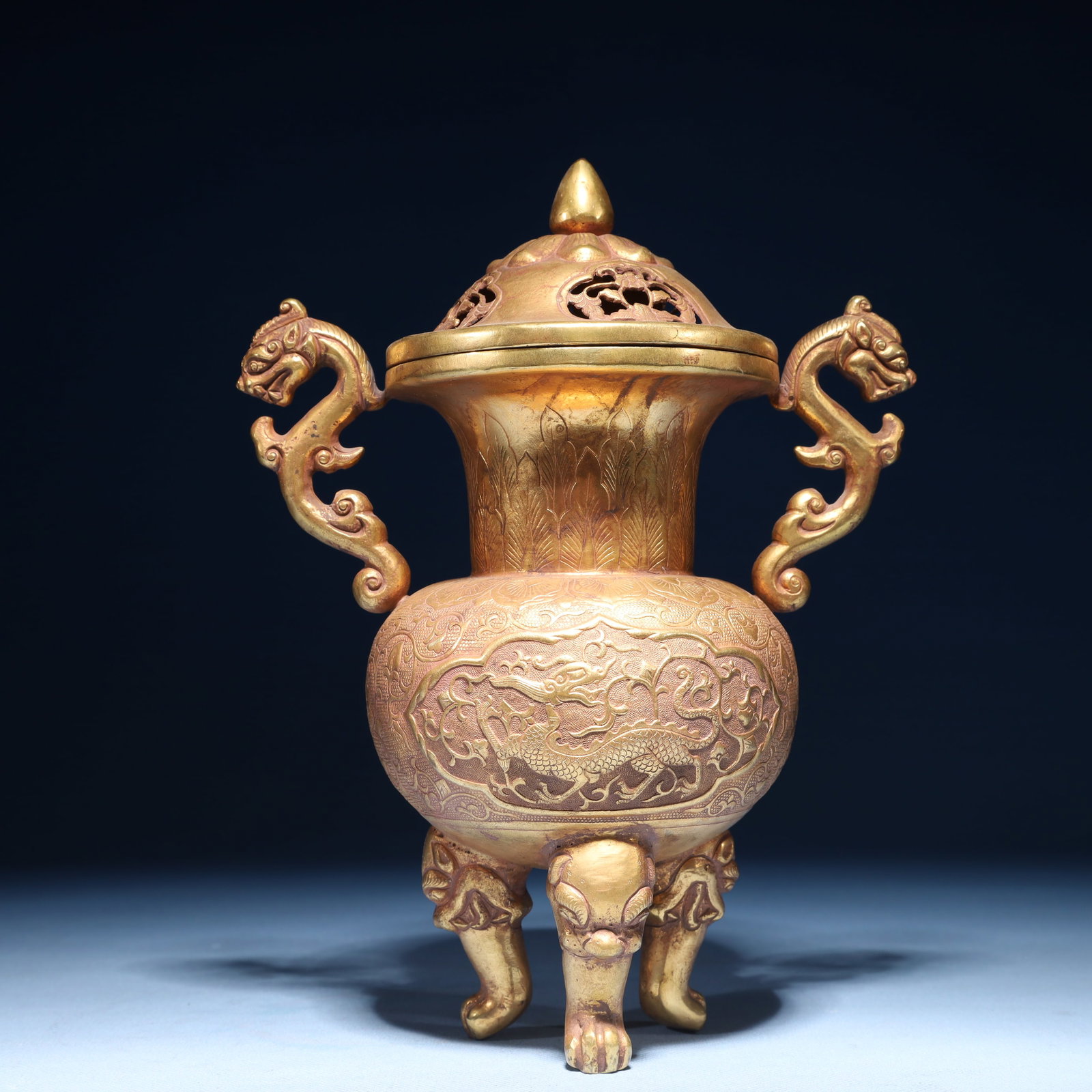 An Exquisite Gilt Bronze Lotus and Dragon Pattern Double-Ears and Tripod Censer: An Exquisite Gilt Bronze Lotus and Dragon Pattern Double-Ears and Tripod Censer,Qing Dynasty,China,Size:4.7inx7.1inx9.8in,Weight:1050g 铜鎏金缠枝莲龙纹&