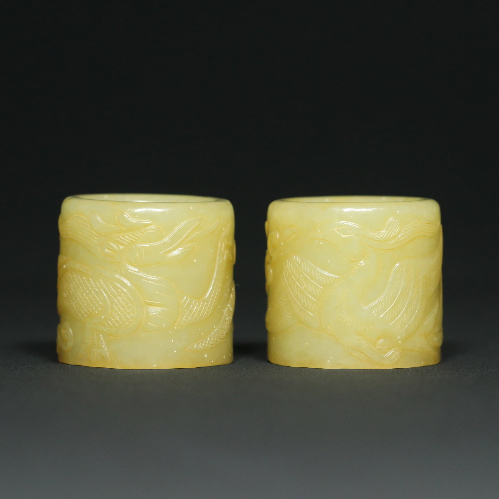 A Pair of Exquisite White Jade Dragon and Phoenix Pattern Fingerstalls: A Pair of Exquisite White Jade Dragon and Phoenix Pattern Fingerstalls,Qing Dynasty,China,Size:1.3inx1.4inx0.9in,Total Weight:94.3g 一对白玉龙凤纹扳