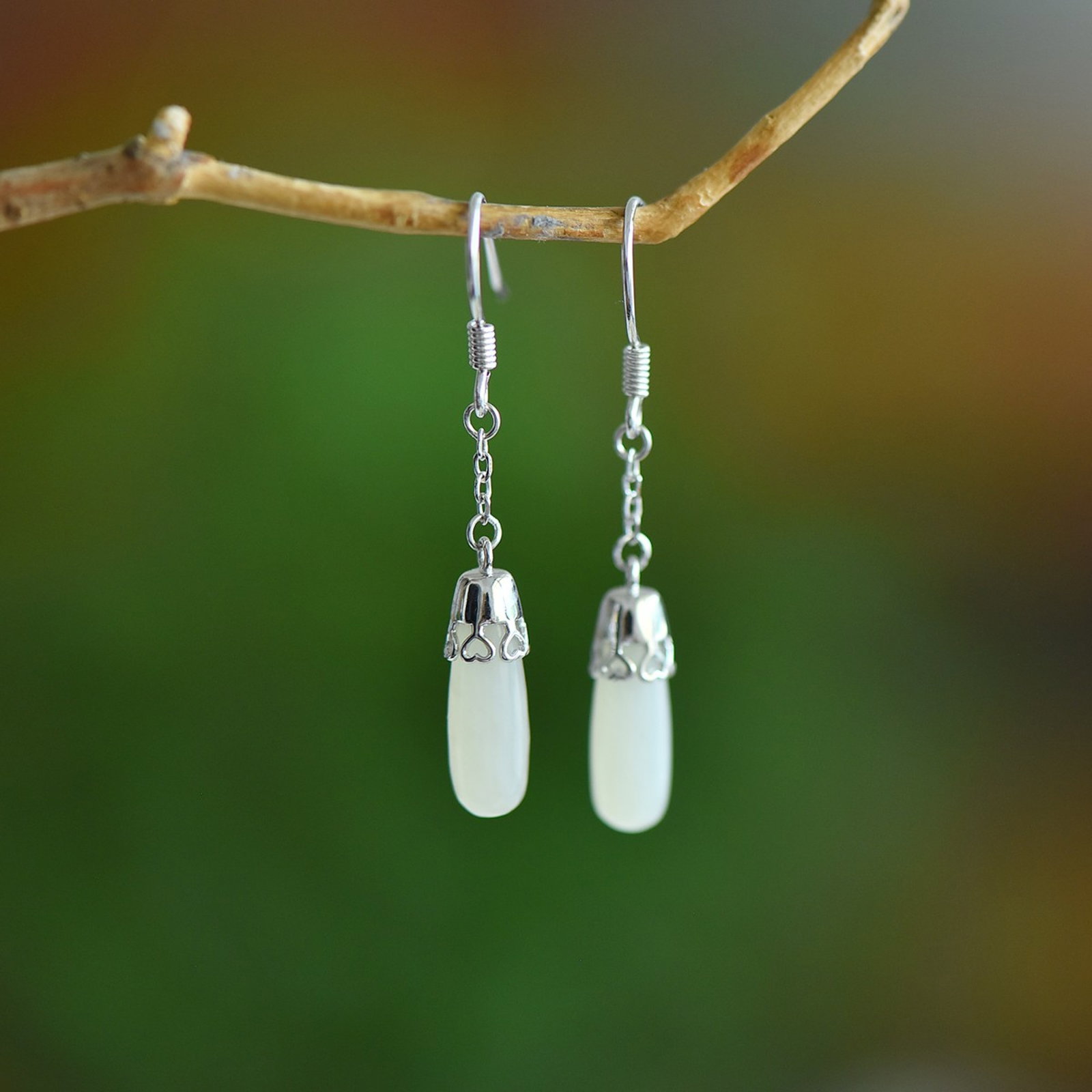 A Pair of Exquisite Sterling Silver Inlaid White Jade Earrings: A Pair of Exquisite Sterling Silver Inlaid White Jade Earrings,Size:5mmx15mm 一对纯银镶白玉耳环
