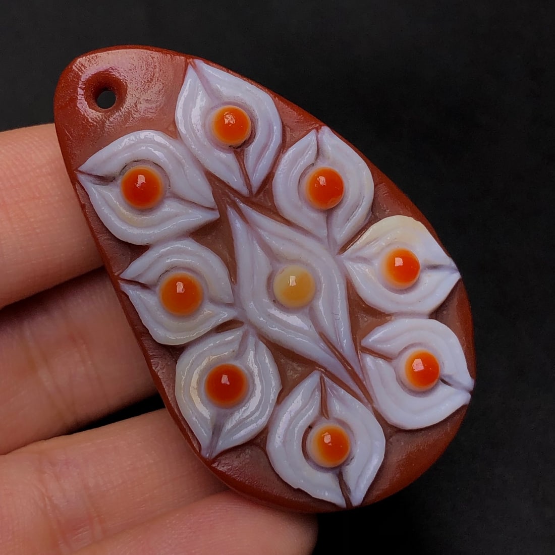 An Exquisite Nine Eyes Dzi Bead Pendant: An Exquisite Nine Eyes Dzi Bead Pendant,Size:52mmx30mmx15mm,Weight:33.9g 九眼天珠挂件