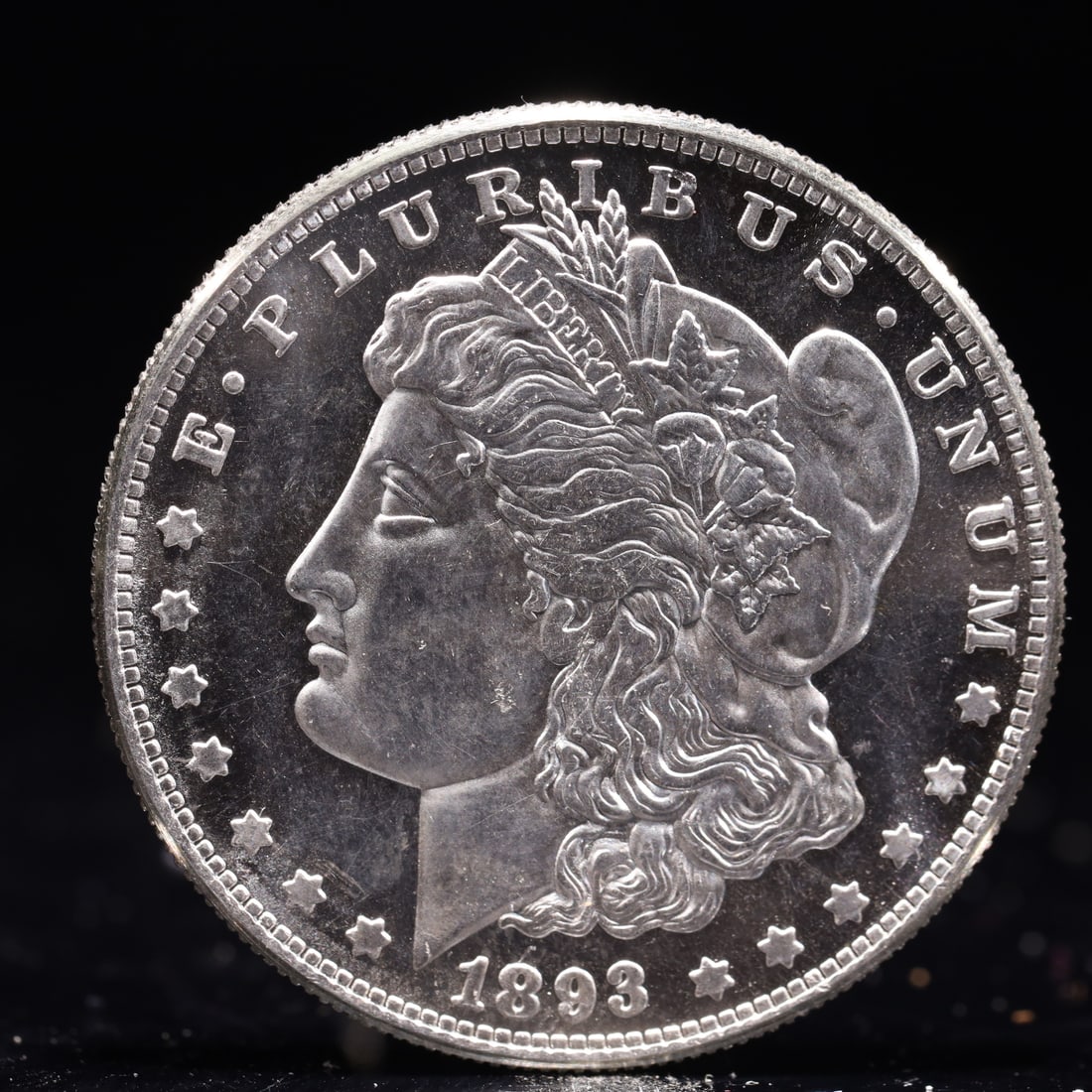 USA Morgan Dollar 1893 Coin: Obv: profile bust with date below and E PLURIBUS UNUM legend and stars around. Rev: eagle with In God we trust above within wreath with UNITED STATES OF AMERICA ONE DOLLAR legend. IN GOD WE TRUST / LI