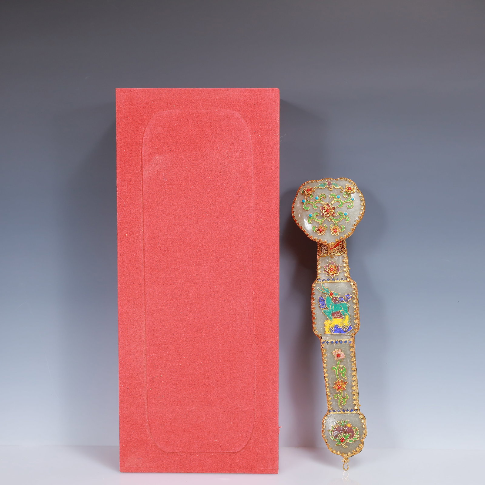 An Exquisite Filigree and Gilding Inlaid Greenish Jade Flower Pattern Ruyi Ornament,Inlaid Gems: An Exquisite Filigree and Gilding Inlaid Greenish Jade Flower Pattern Ruyi Ornament,Inlaid Gems,Qing Dynasty, China,Qianlong Four-Character Mark,Size:14.2inx3.7inx2.8in,(Box)18.1inx10.2inx4.3in,Weight