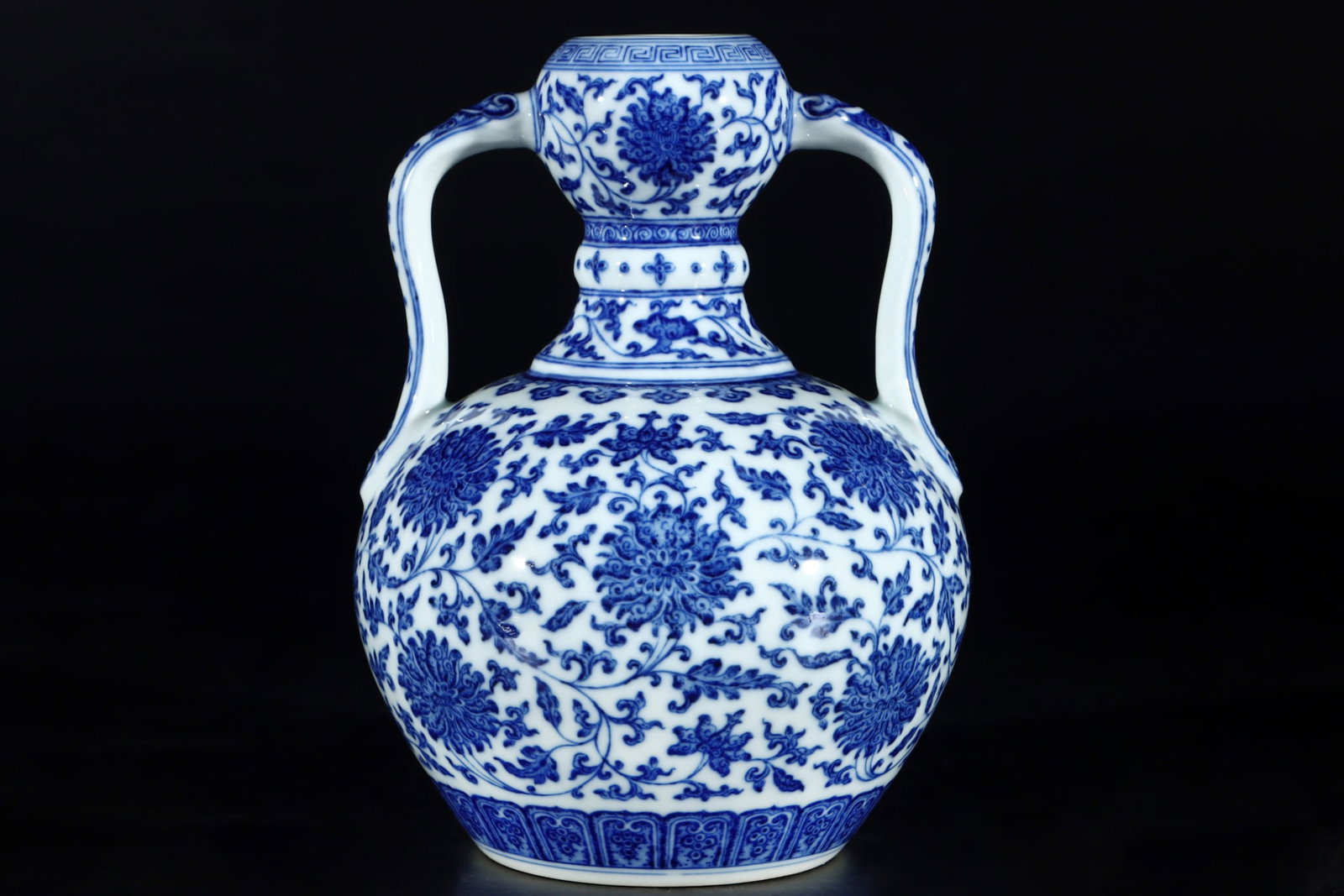 An Exquisite Blue and White Lotus Pattern Double-Ears Vase: An Exquisite Blue and White Lotus Pattern Double-Ears Vase,Qing Dynasty,China,Qianlong Six-character Mark,Size:9.1inx6.9in 青花缠枝莲纹双耳瓶,