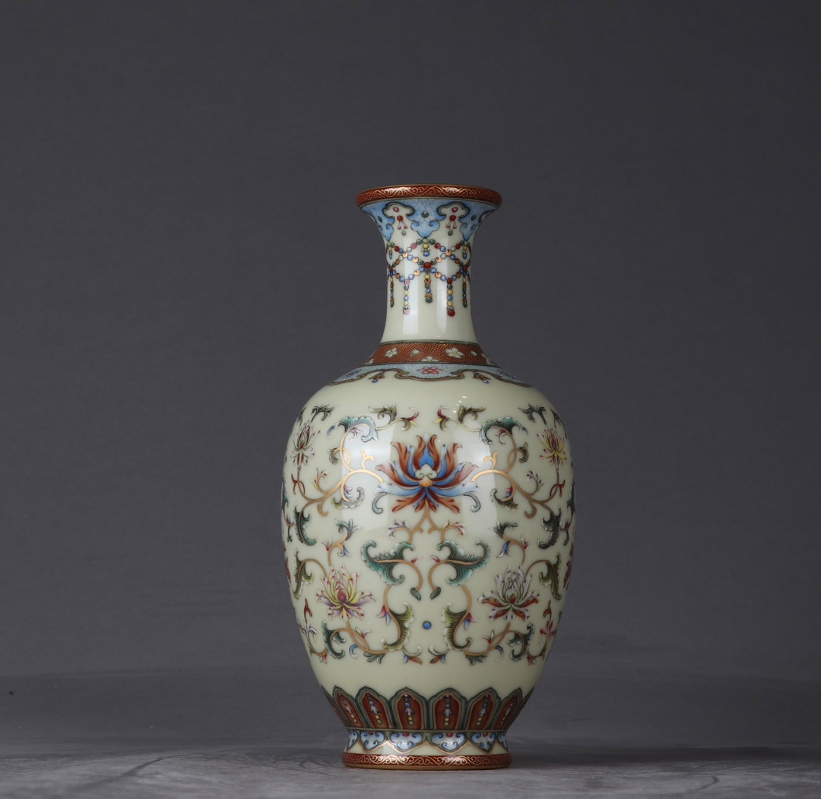 An Exquisite Enamel Yellow Glazed Lotus Pattern Vase: An Exquisite Enamel Yellow Glazed Lotus Pattern Vase,Qing Dynasty,China,Qianlong Six-character Mark,Size:8.1inx3.7in 珐琅彩黄釉缠枝莲纹瓶,&#