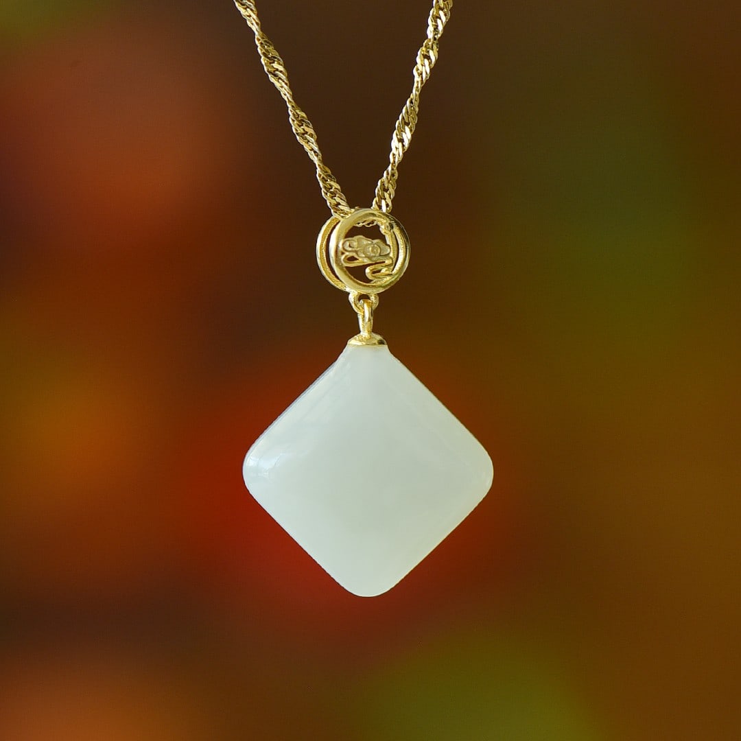 An Exquisite Sterling Silver-Gold Plated Inlaid White Jade Pendant: An Exquisite Sterling Silver-Gold Plated Inlaid White Jade Pendant 纯银镀金镶白玉吊坠