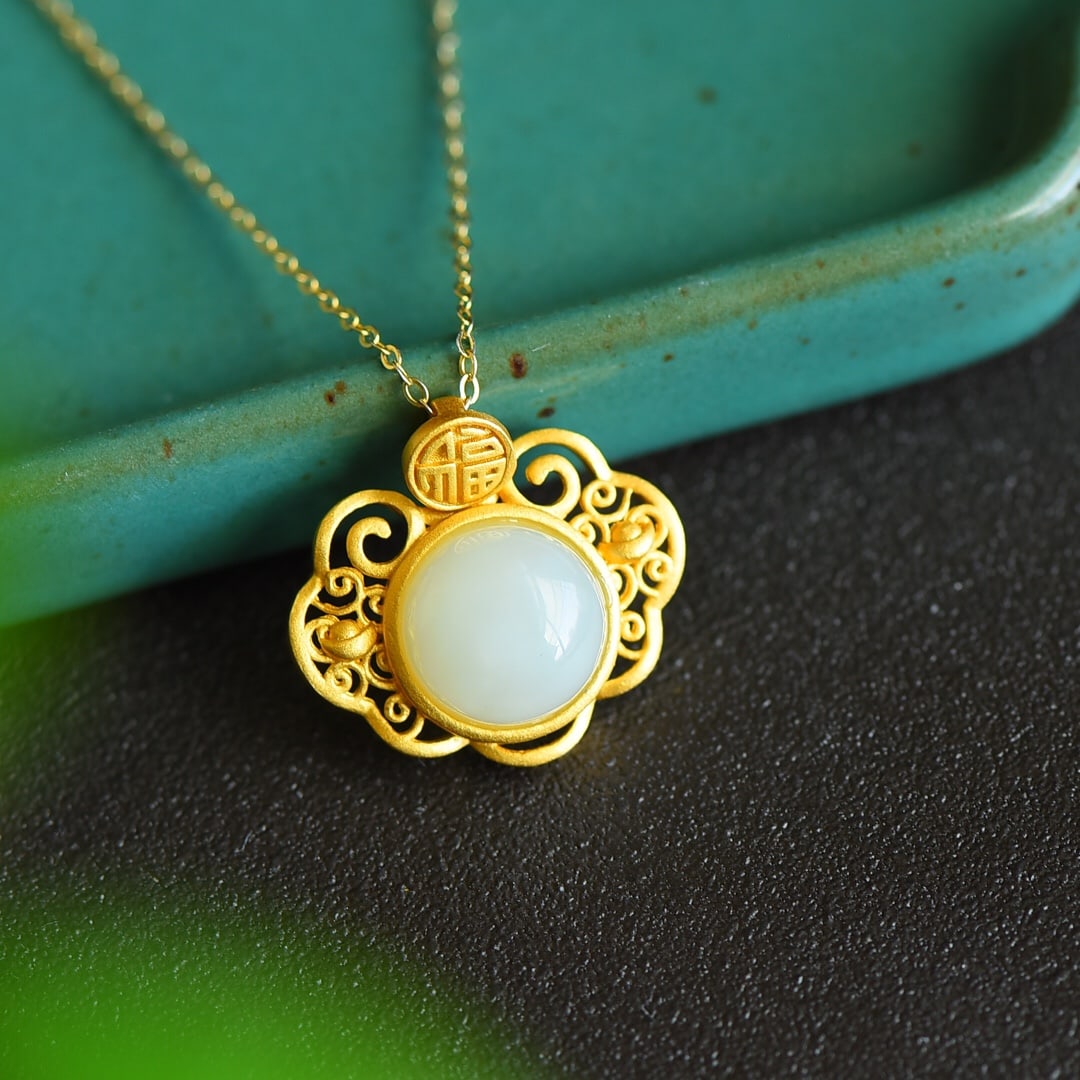 An Exquisite Sterling Silver-Gold Plated Inlaid White Jade Pendant: An Exquisite Sterling Silver-Gold Plated Inlaid White Jade Pendant 纯银镀金镶白玉吊坠
