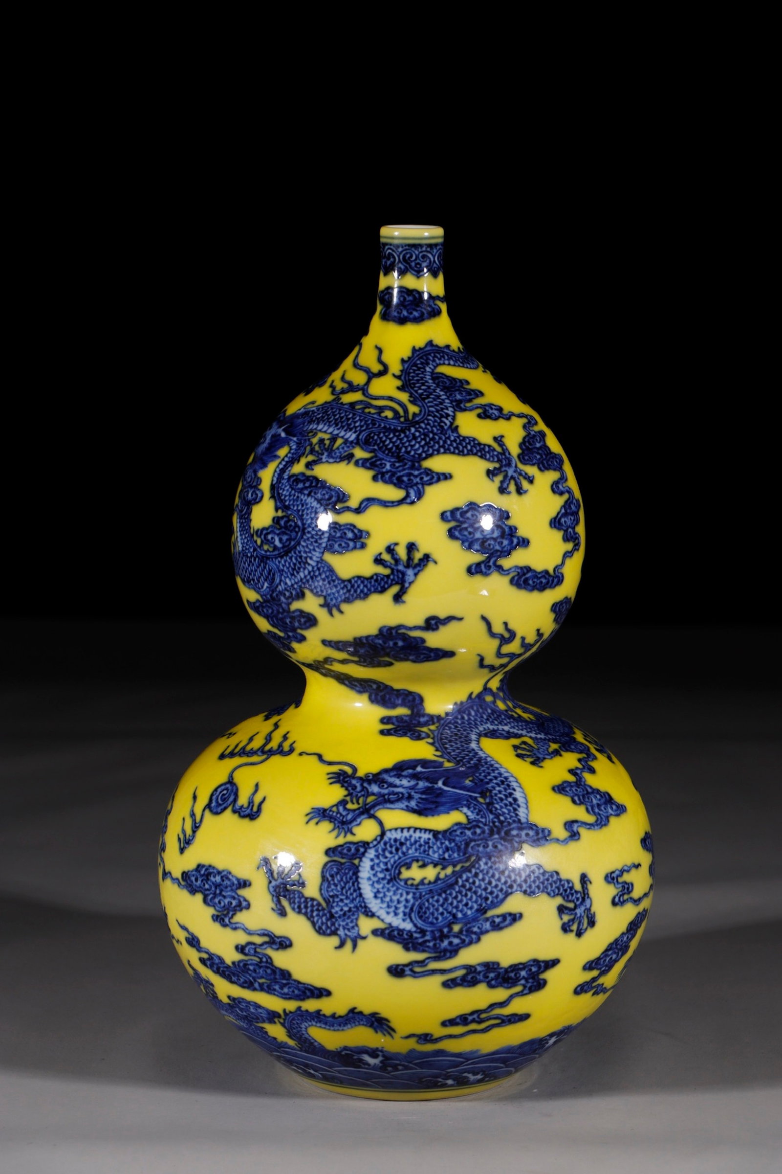 A Rare Yellow Ground Blue and White Auspicious Cloud and Dragon Pattern Gourd-Shaped Vase: A Rare Yellow Ground Blue and White Auspicious Cloud and Dragon Pattern Gourd-Shaped Vase,Qing Dynasty,China,Qianlong Six-character Mark,Size:13.8in 黄地青花祥云
