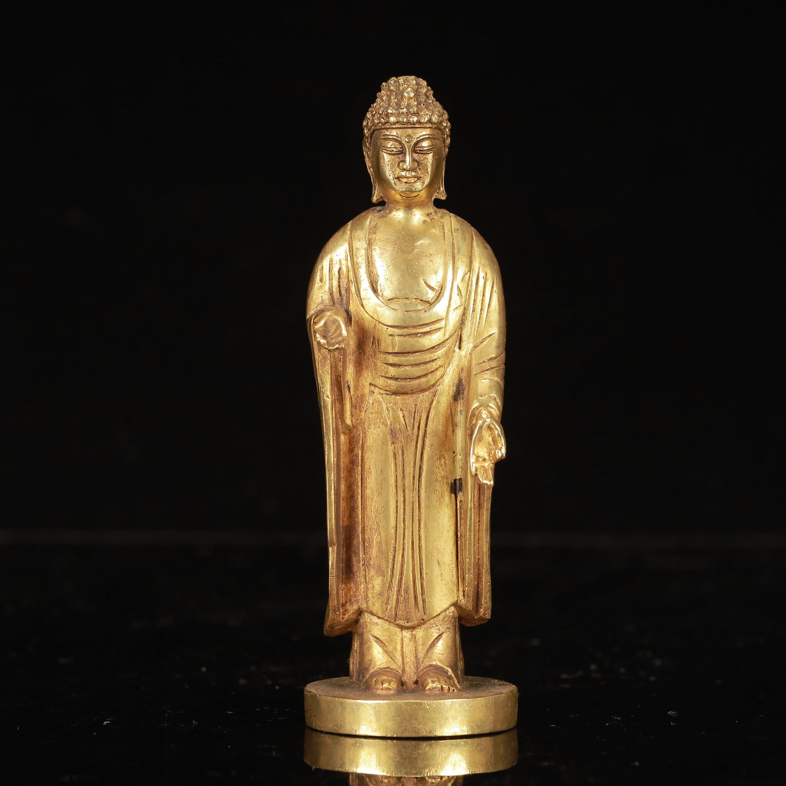 An Exquisite Gilt Bronze Statue of Sakyamuni: An Exquisite Gilt Bronze Statue of Sakyamuni,Qing Dynasty, China,Size:2inx1.8inx5.5in,Weight:350g 铜鎏金释迦摩尼像,中国清代