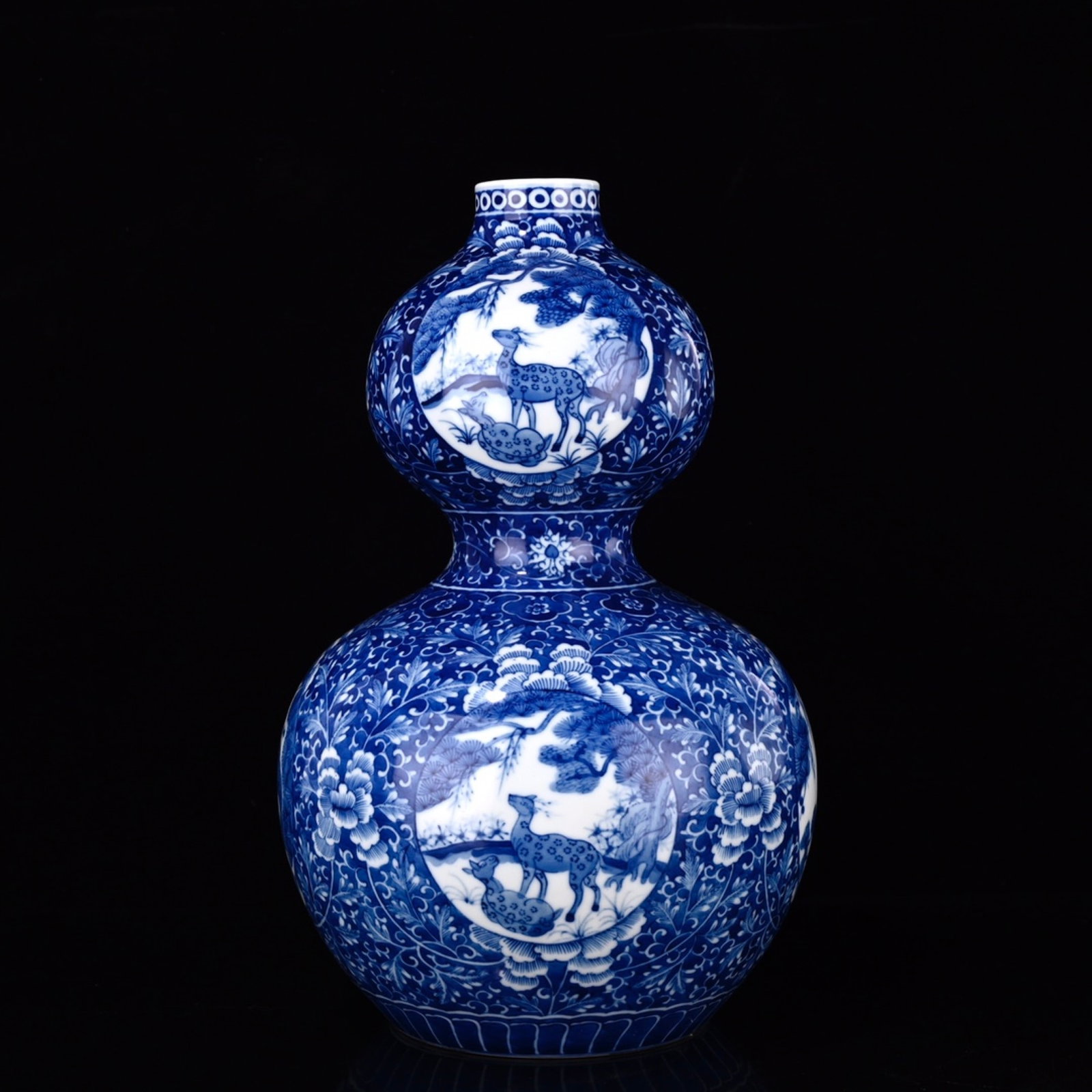 A Rare Blue and White Lotus Pattern Gourd-Shaped Vase: A Rare Blue and White Lotus Pattern Gourd-Shaped Vase,Qing Dynasty,China,Qianlong Six-character Mark,Size:13inx7.9in 青花缠枝莲纹葫芦瓶,中&#