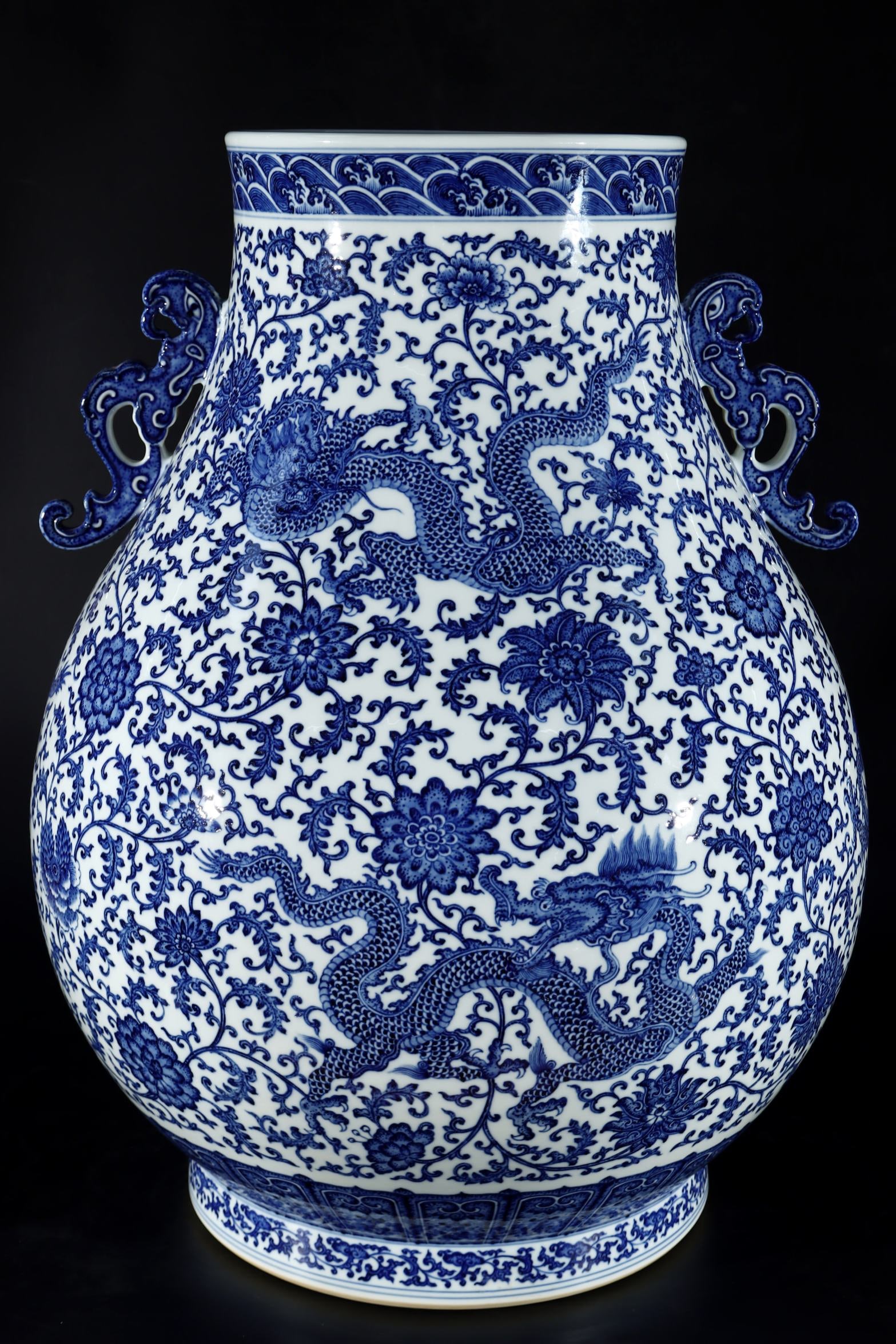 An Exquisite Blue and White Lotus and Dragon Pattern Double-Ears Vase: An Exquisite Blue and White Lotus and Dragon Pattern Double-Ears Vase,Qing Dynasty,China,Qianlong Six-character Mark,Size:27.2inx20.5in 青花缠枝莲龙纹双