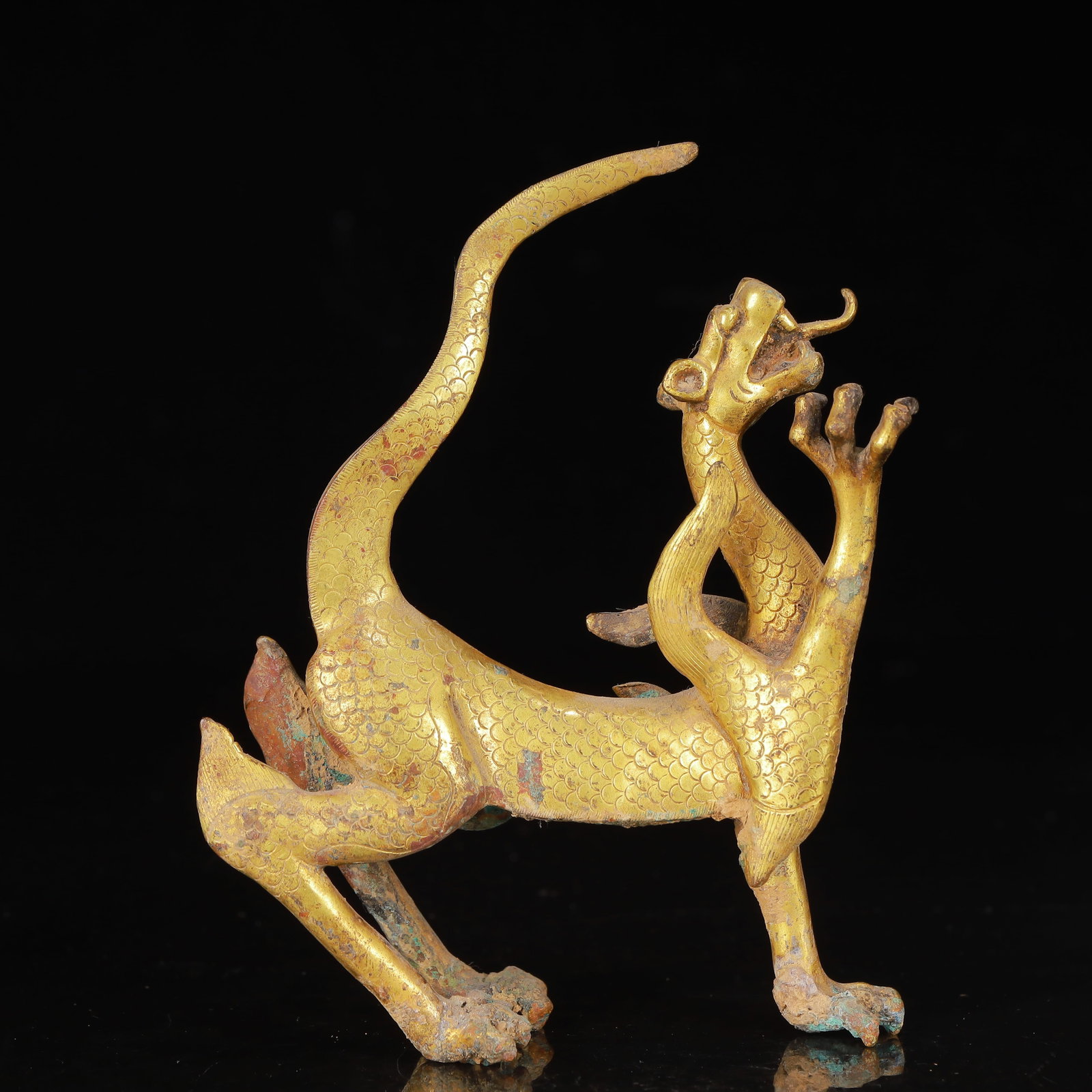 An Exquisite Gilt Bronze Auspicious Beast Ornament: An Exquisite Gilt Bronze Auspicious Beast Ornament,Qing Dynasty,China,Size:3.5inx1.2inx4.3in,Weight:357g 铜鎏金瑞兽摆件,中国清代