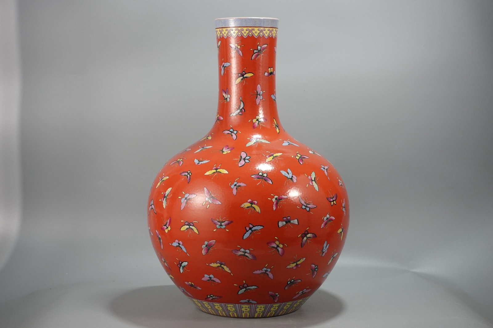 A Huge Coral Red Glazed Butterfly Pattern Vase: A Huge Coral Red Glazed Butterfly Pattern Vase,Qing Dynasty,China,Qianlong Six-character Mark,Size:22.8inx16.1in 珊瑚红蝴蝶纹瓶,中国清ߣ