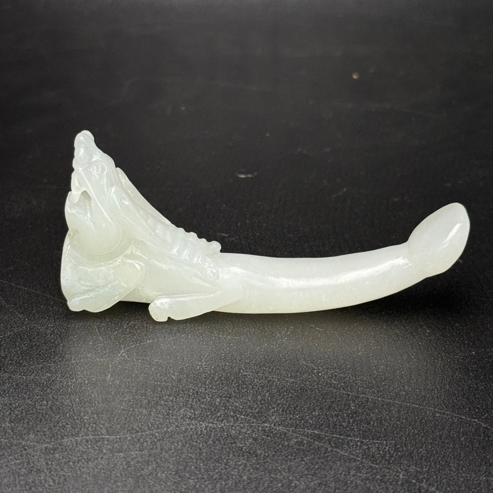 An Exquisite White Jade Dragon Ornament: An Exquisite White Jade Dragon Ornament,Qing Dynasty,China,Size:3inx1.4inx0.6in,Weight:31g 白玉龙摆件,中国清代