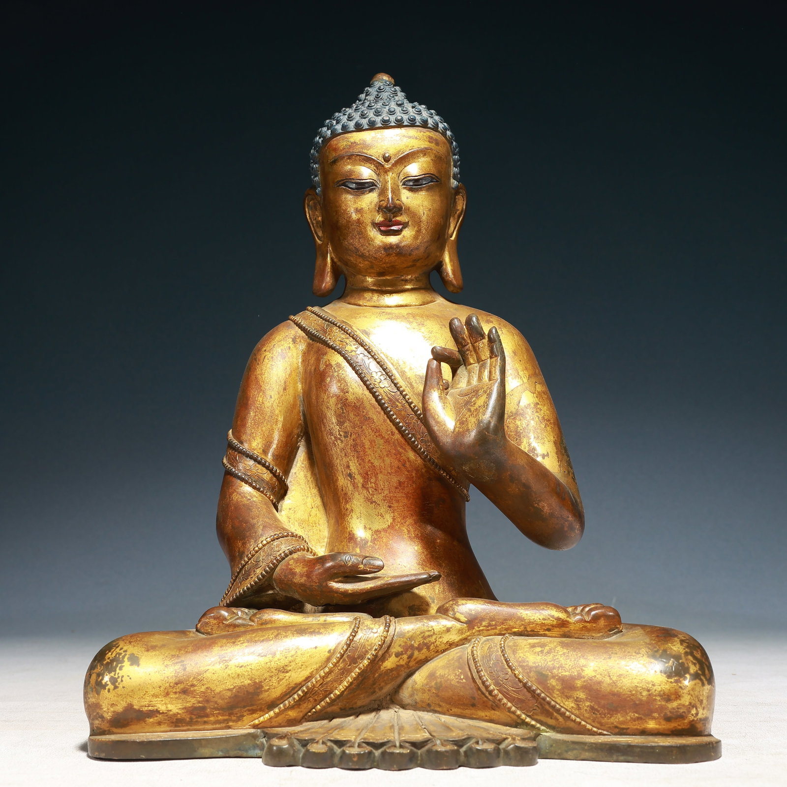 A Solemn Gilt Bronze Statue of Sakyamuni: A Solemn Gilt Bronze Statue of Sakyamuni,Qing Dynasty,China,Size:9.8inx6.7inx13in,Weight:7350g 铜鎏金释迦摩尼像,中国清代