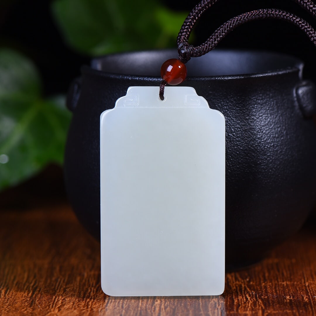 An Exquisite White Jade Pendant: An Exquisite White Jade Pendant,Size:1.2inx2in (寓意)吉祥 保平安 顺风顺水 白玉牌
