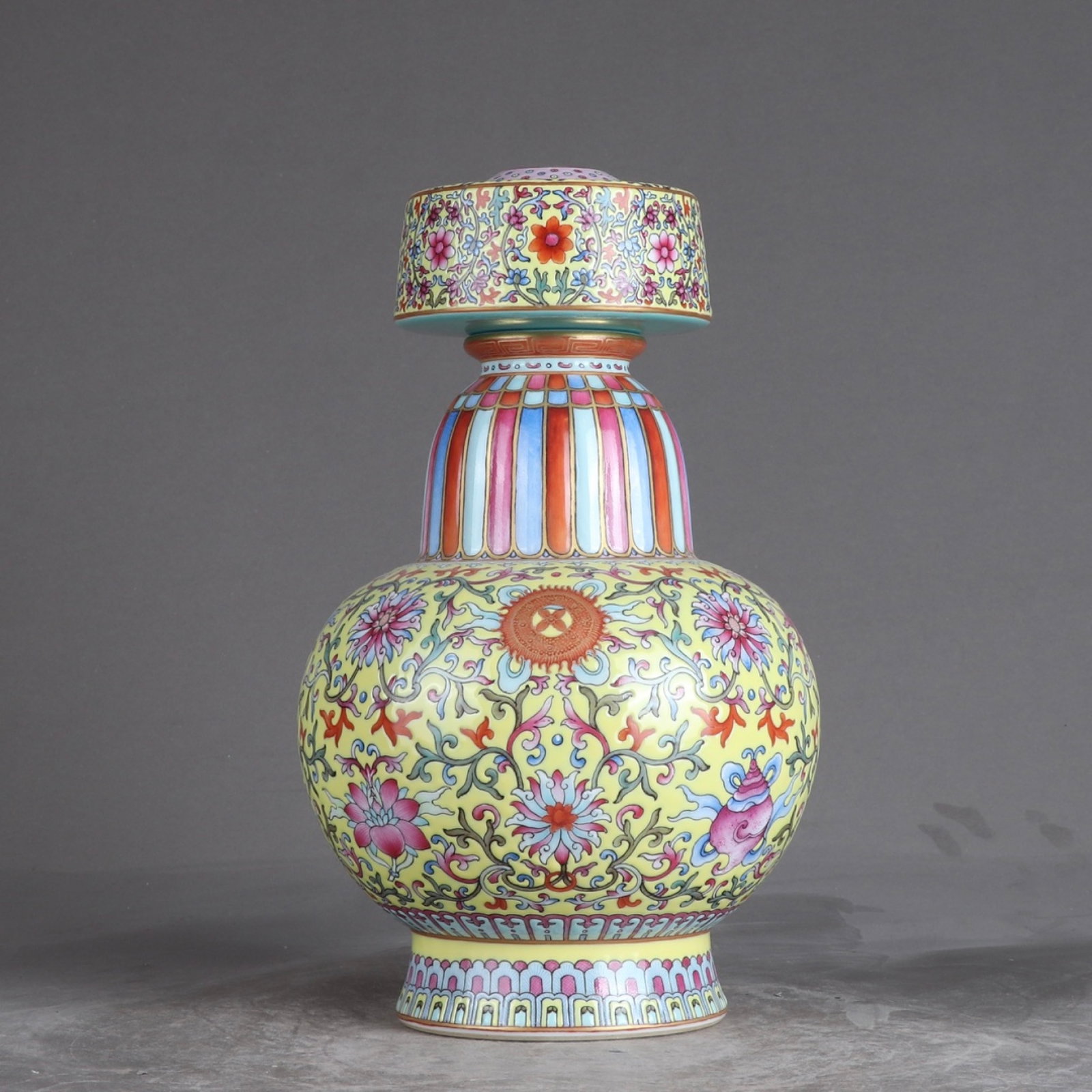 An Exquisite Yellow Ground Famille-Rose Lotus Pattern Vase: An Exquisite Yellow Ground Famille-Rose Lotus Pattern Vase,Qing Dynasty,China,Qianlong Six-character Mark,Size:10.2inx6.5in 黄地粉彩缠枝莲纹瓶,