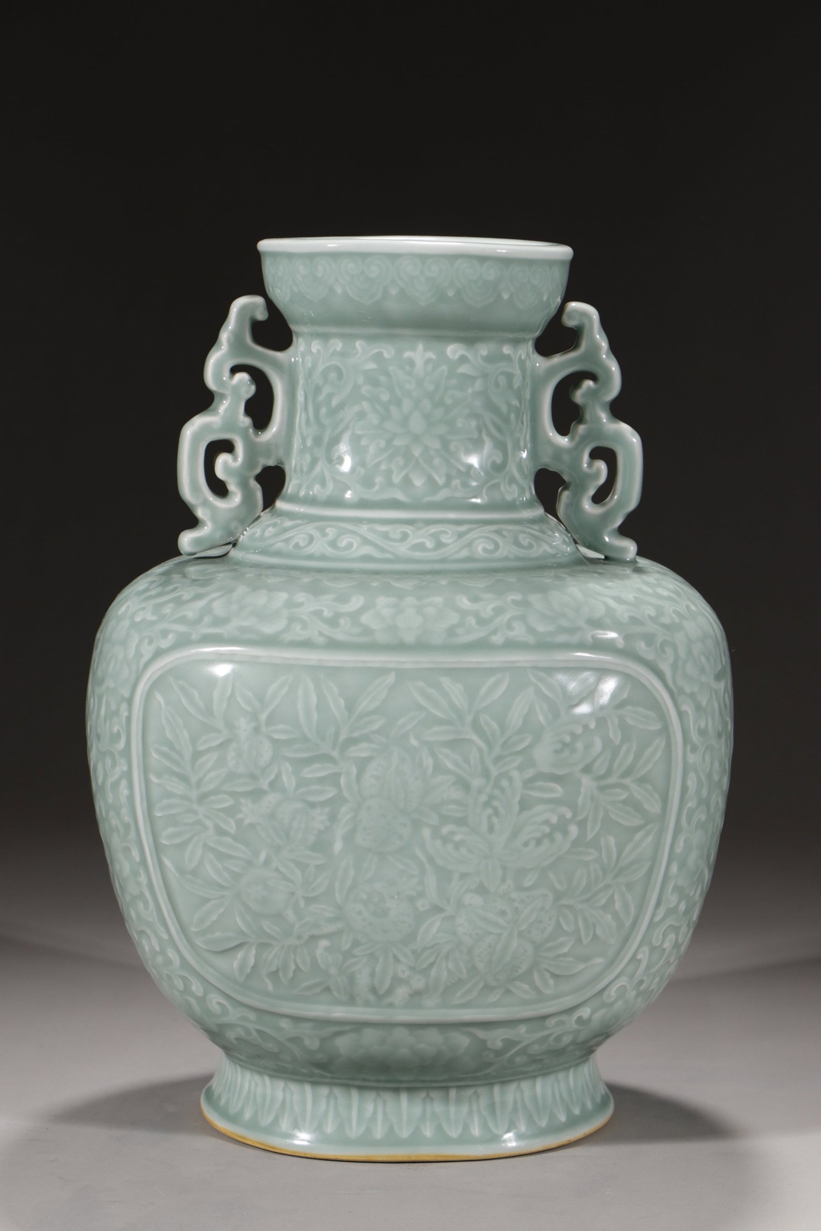 A Rare Celadon Glazed Flower and Fruit Pattern Double-Ears Vase: A Rare Celadon Glazed Flower and Fruit Pattern Double-Ears Vase,Qing Dynasty,China,Qianlong Six-character Mark,Size:14.4in 粉青釉花果纹双耳瓶È