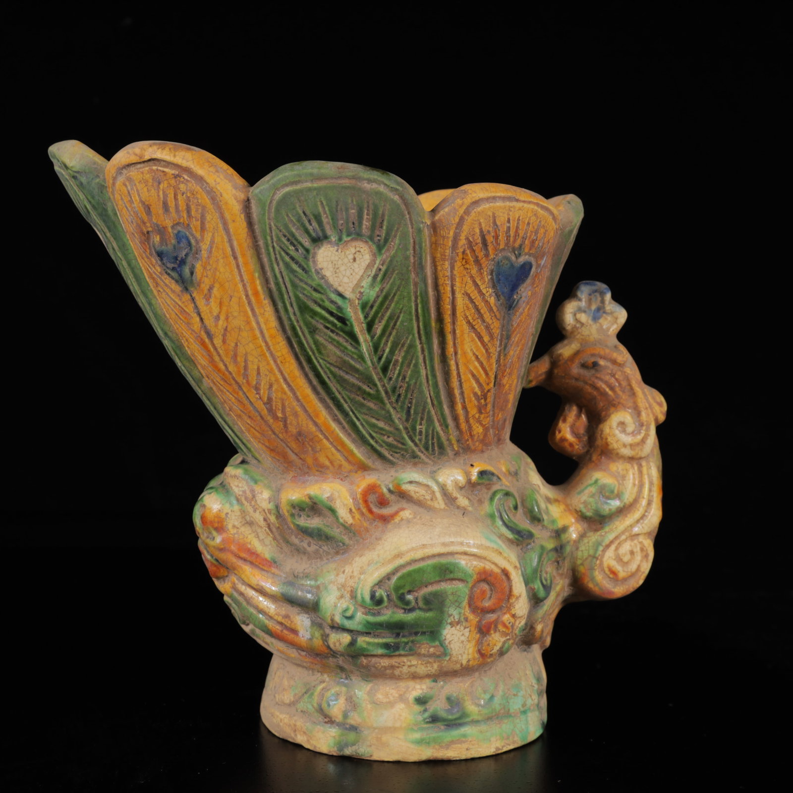 An Exquisite Tang Tri-Color Glazed Pottery Peacock teapot: An Exquisite Tang Tri-Color Glazed Pottery Peacock teapot,Tang Dynasty,China,Size:6.3inx7.1inx4.7in,Weight:850g 唐三彩孔雀壶,中国唐代