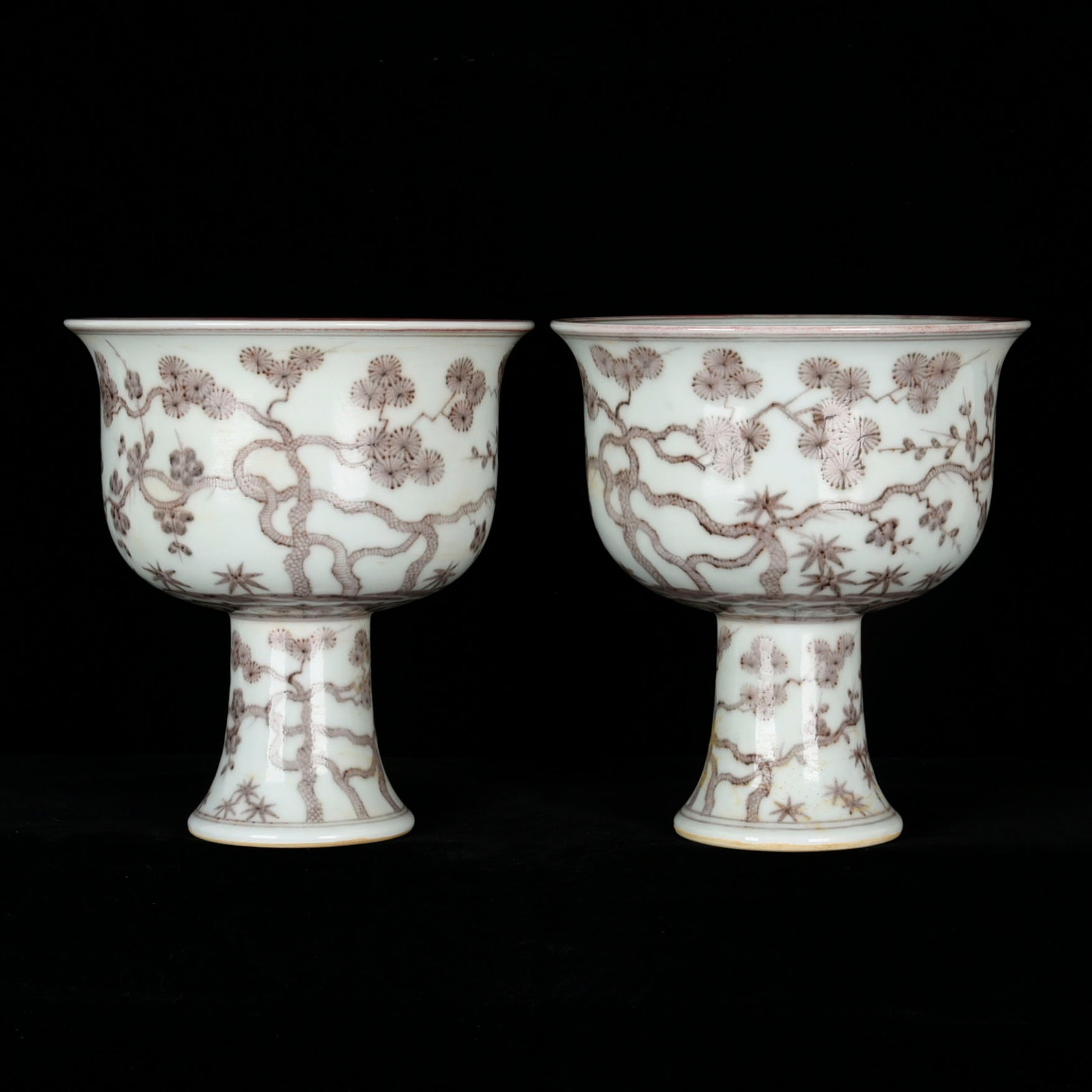 A Pair of Exquisite Underglaze-Red Pine,Bamboo and Plum Blossom Pattern Stem Bowls: A Pair of Exquisite Underglaze-Red Pine,Bamboo and Plum Blossom Pattern Stem Bowl,Ming Dynasty,China,Xuande Six-character Mark,Size:6.7inx6.1ins 一对釉里红松竹
