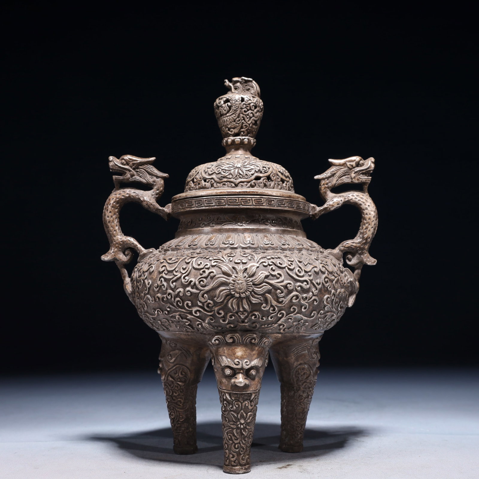 An Exquisite Silver-plated Bronze Lotus Pattern Double-Ears and Tripod Censer: An Exquisite Silver-plated Bronze Lotus Pattern Double-Ears and Tripod Censer,Ming Dynasty,China,Xuande Six-character Mark,Size:6.3inx5.1inx9.1in,Weight:1200g 铜镀银缠枝&