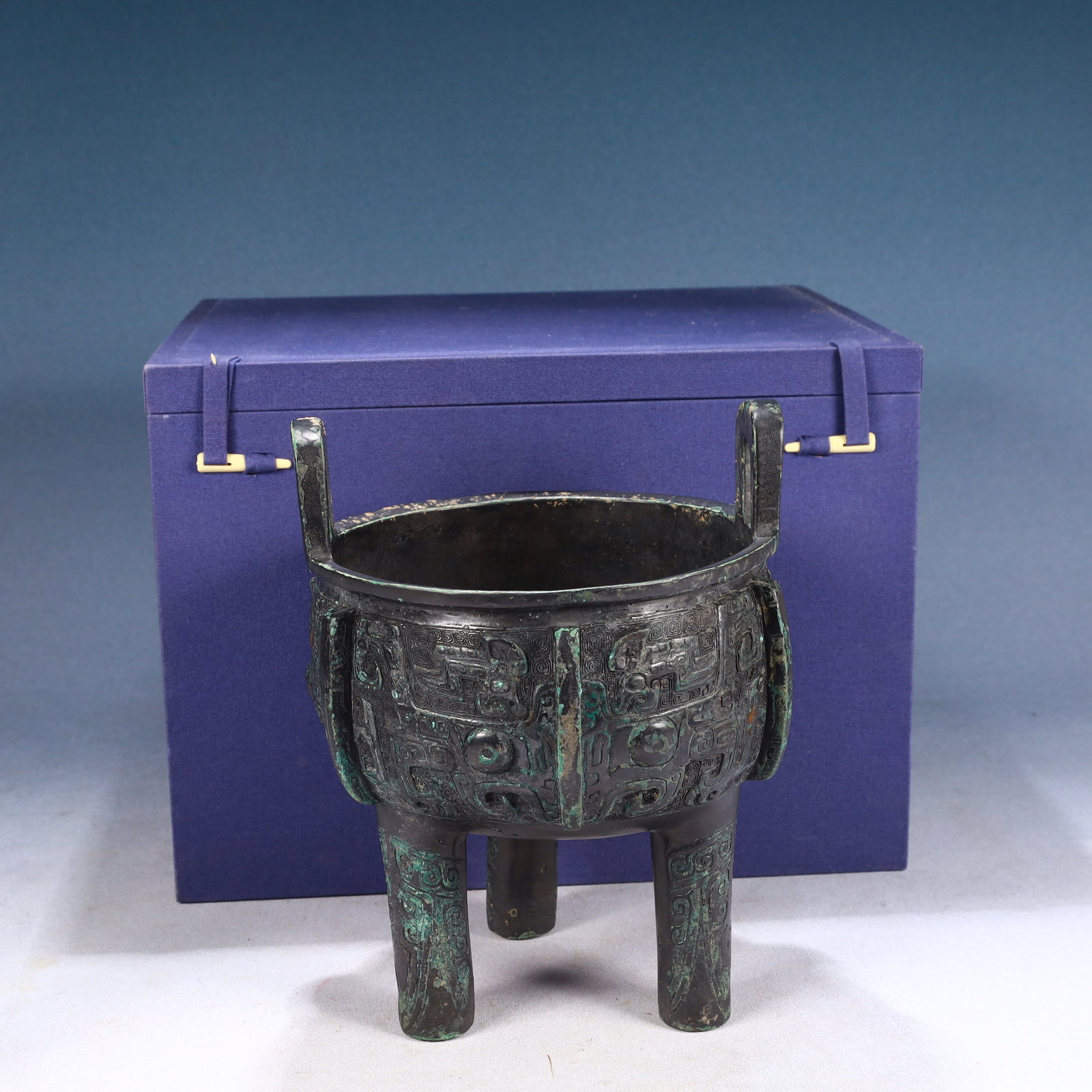 An Archaic Bronze Beast-Face Pattern Double-Ears and Tripod Censer,With Inscription: An Archaic Bronze Beast-Face Pattern Double-Ears and Tripod Censer,With Inscription,Qing Dynasty, China,Size:7.3inx9.4in,Weight:3850g 青铜兽面纹双耳三&#