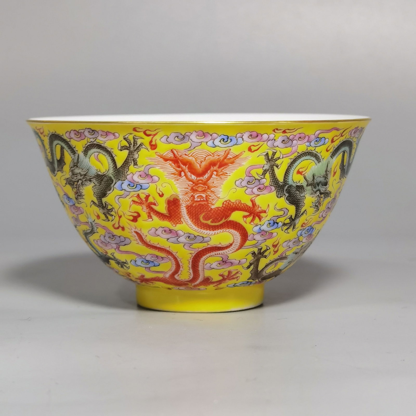 An Exquisite Yellow Ground Famille-Rose Auspicious Cloud and Dragon Pattern Bowl: An Exquisite Yellow Ground Famille-Rose Auspicious Cloud and Dragon Pattern Bowl,Qing Dynasty,China,Qianlong Four-character Mark,Size:3.1inx1.7in