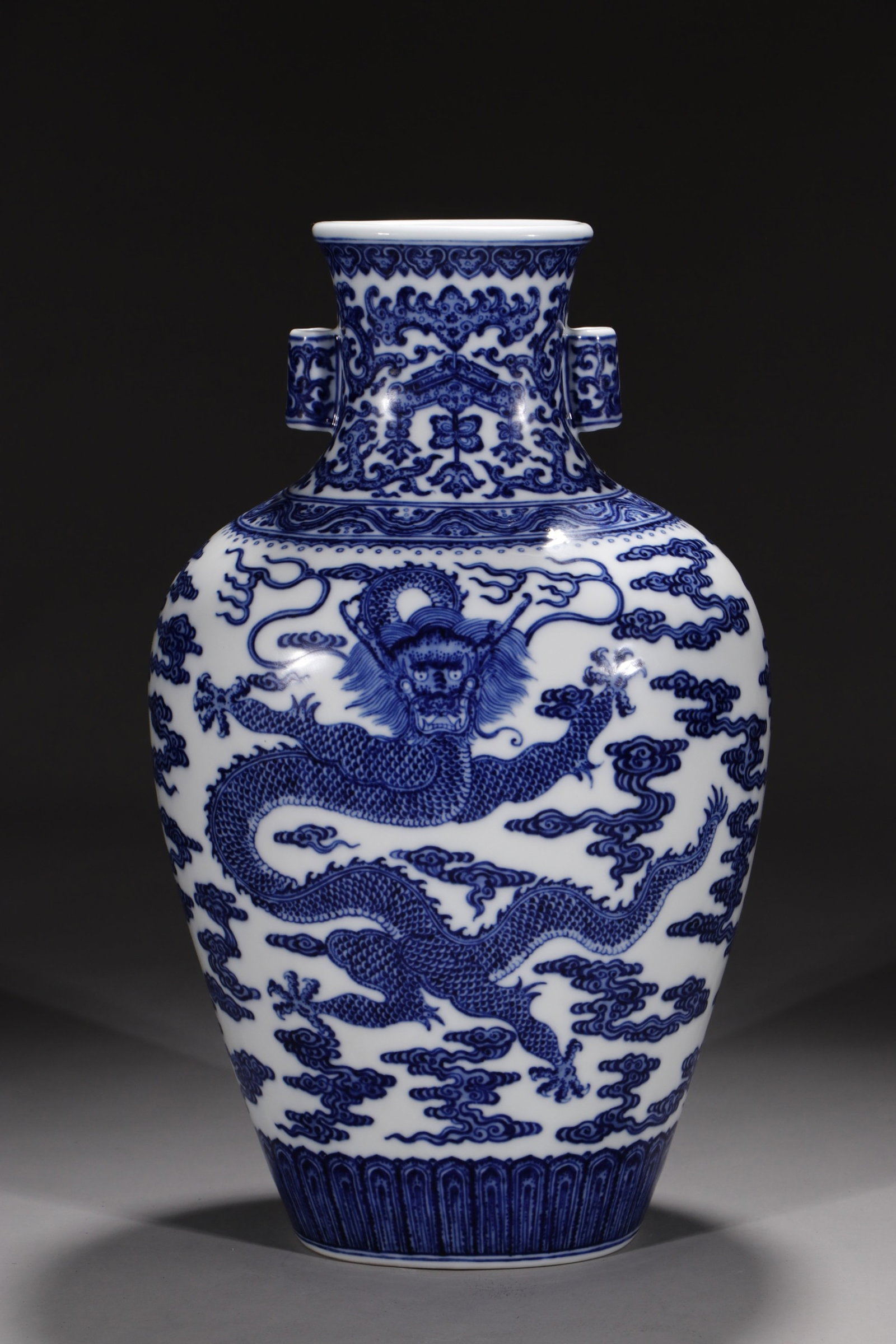 A Rare Blue and White Auspicious Cloud and Dragon Pattern Double-Ears Vase: A Rare Blue and White Auspicious Cloud and Dragon Pattern Double-Ears Vase,Qing Dynasty,China,Qianlong Six-character Mark,Size:13.8in 青花祥云龙纹双耳&#