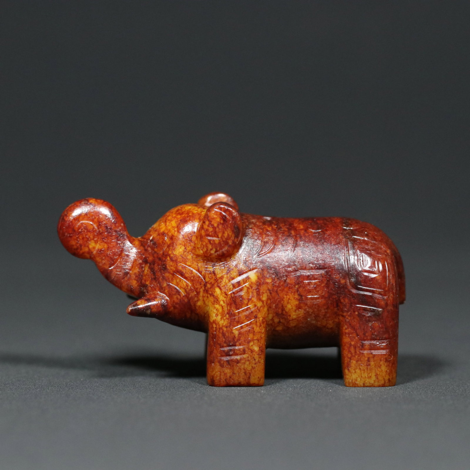 An Exquisite Archaic Jade Elephant Ornament,With Inscription: An Exquisite Archaic Jade Elephant Ornament,With Inscription,Western Zhou Dynasty,China,Size:3.3inx1.3inx1.7in,Weight:161.9g 高古玉象摆件,带铭文,&