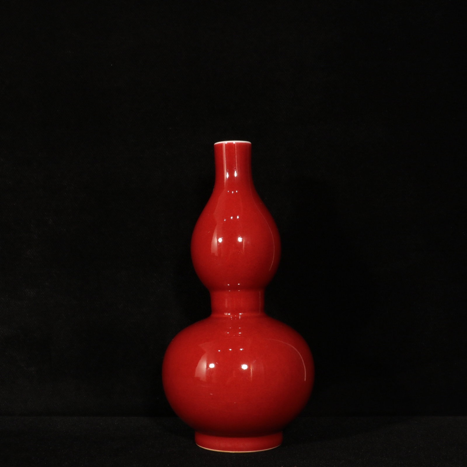 An Exquisite Red Glazed Gourd-Shaped Vase: An Exquisite Red Glazed Gourd-Shaped Vase,Qing Dynasty,China,Kangxi Six-character Mark,Size:8.9inx4.1in 红釉葫芦瓶,中国清代,康熙ࠤ