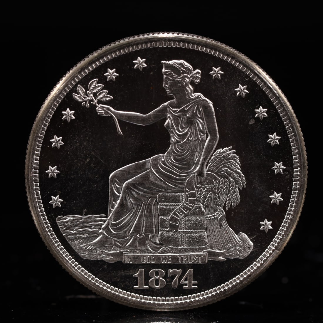 USA Trade Dollar 1874 Coin: American coin. Obverse: Liberty seated on a pedestal facing the sea to the left holding olive branches surrounded by 13 stars. IN GOD WE TRUST / LIBERTY / 1874. Reverse: An eagle holding branches with