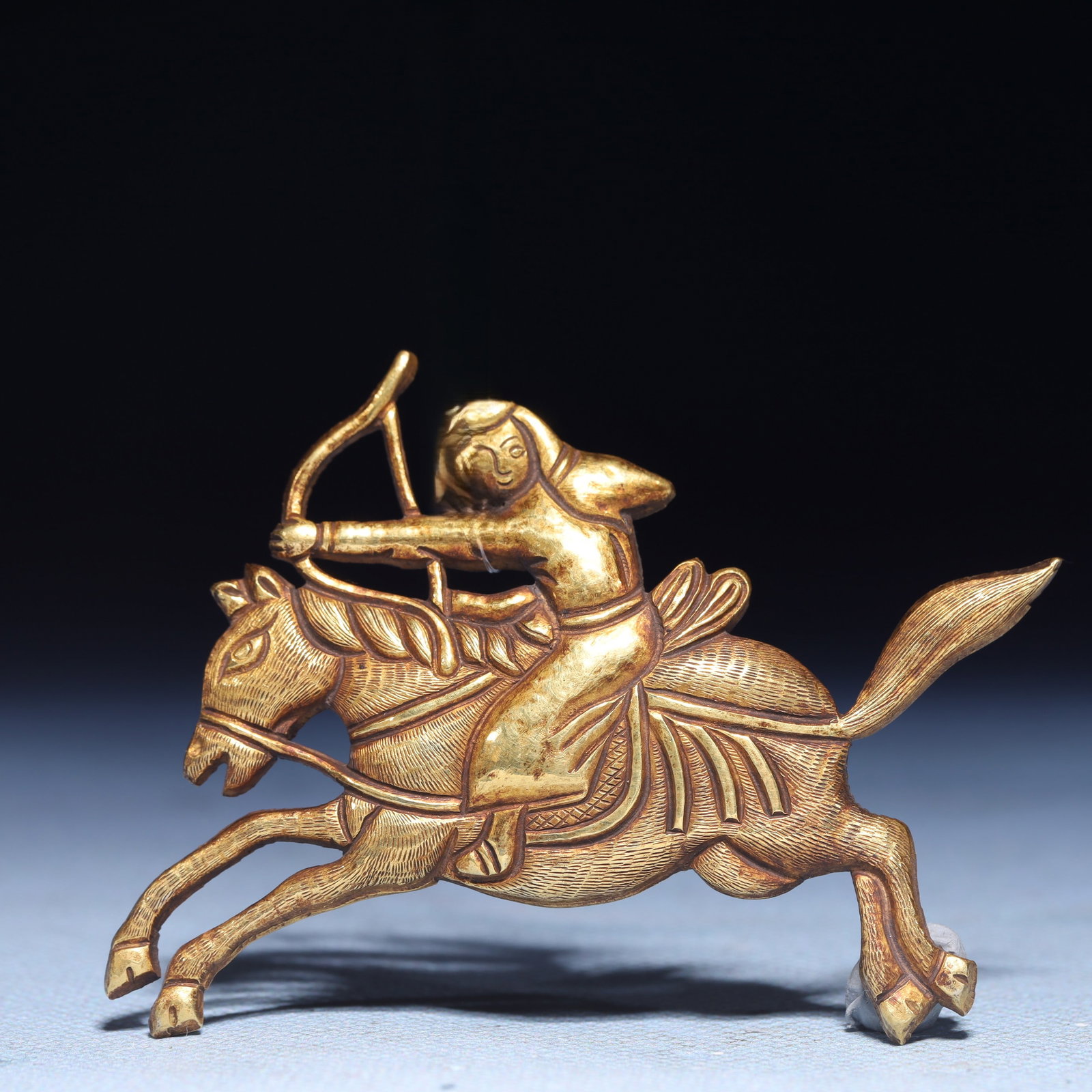 An Exquisite Gilt Silver Figure Riding Horse Ornament: An Exquisite Gilt Silver Figure Riding Horse Ornament,Qing Dynasty,China,Size:2.8inx2in,Weight:20.05g 银鎏金人物骑马摆件,中国清&