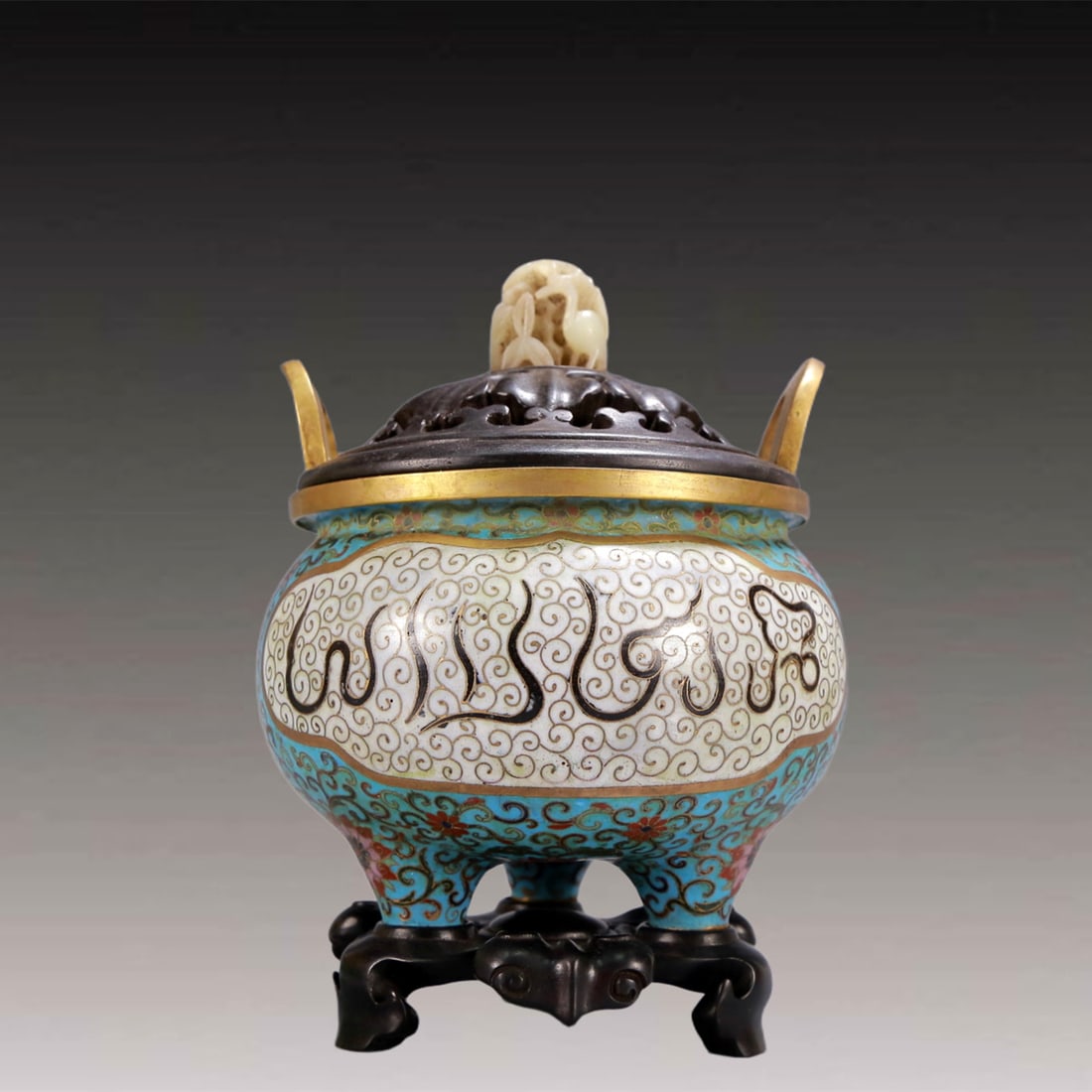 An Archaic Cloisonne Lotus Pattern Double-Ears and Tripod Censer,with Arabic,with Zitanwood Inlaid: An Archaic Cloisonne Lotus Pattern Double-Ears and Tripod Censer,with Arabic,with Zitanwood Inlaid White Jade Cover,Qing Dynasty, China,Qianlong Four-character Mark,Size:5.7inx5.3inx8.3in,Weight:1250g