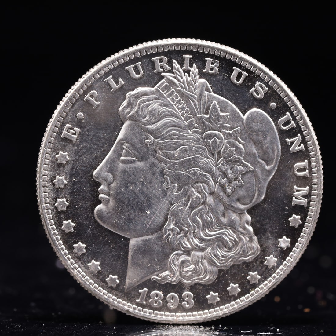 USA Morgan Dollar 1893 Coin: Obv: profile bust with date below and E PLURIBUS UNUM legend and stars around. Rev: eagle with In God we trust above within wreath with UNITED STATES OF AMERICA ONE DOLLAR legend. IN GOD WE TRUST / LI