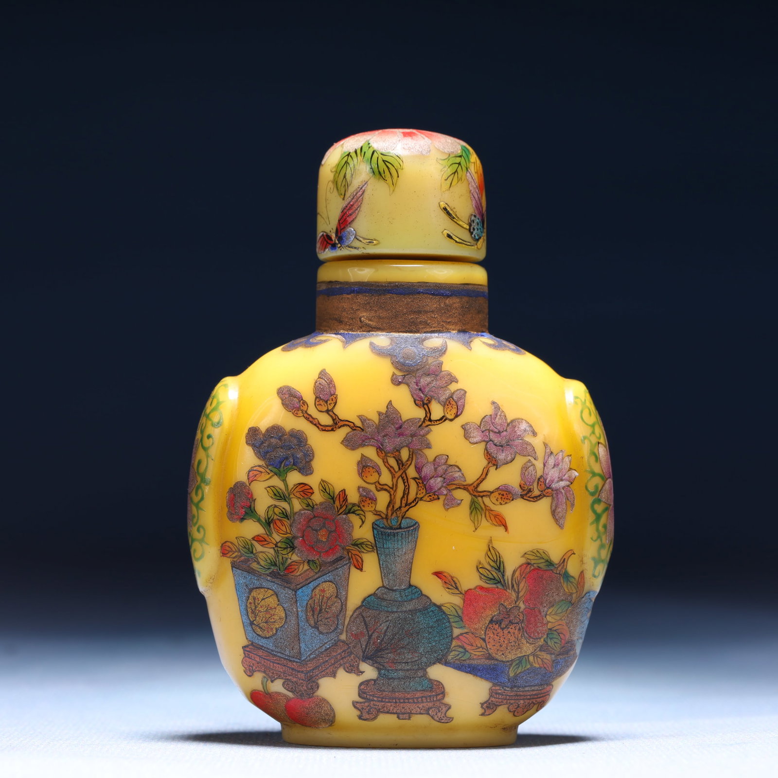 An Exquisite Glass Flower and Fruit Pattern Snuff Bottle: An Exquisite Glass Flower and Fruit Pattern Snuff Bottle,Qing Dynasty,China,Qianlong Four-character Mark,Size:2.6inx1.4inx3.5in,Weight:228g 琉璃花果纹鼻烟