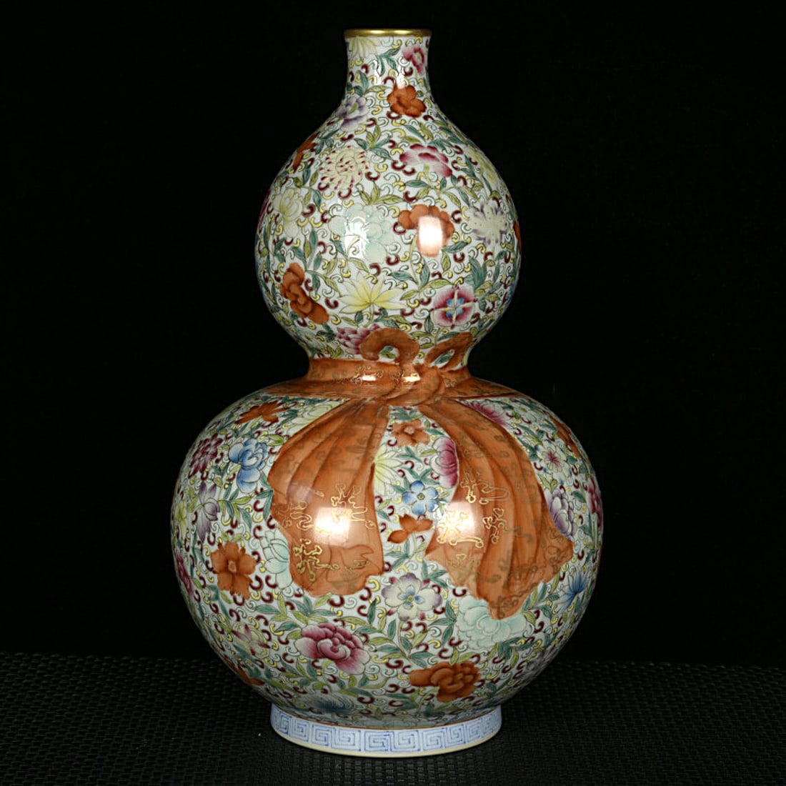 An Exquisite Enamel Painted Gold Flower Pattern Gourd-Shaped Vase: An Exquisite Enamel Painted Gold Flower Pattern Gourd-Shaped Vase,Qing Dynasty,China,Qianlong Six-character Mark,Size:11.6inx7.5in 珐琅彩描金花卉纹Œ